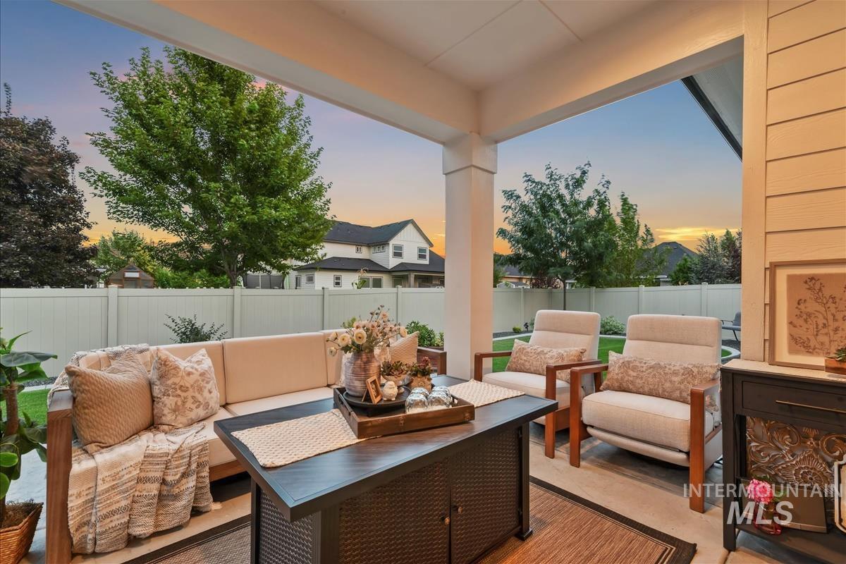 Fenced backyard featuring an outdoor living space and a patio