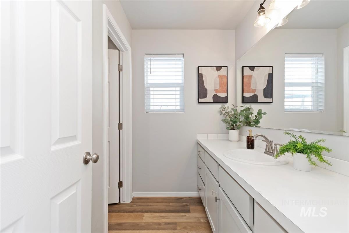 Bathroom featuring vanity and light wood-style flooring