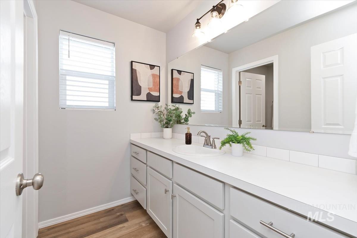 Bathroom with vanity and light wood-style flooring