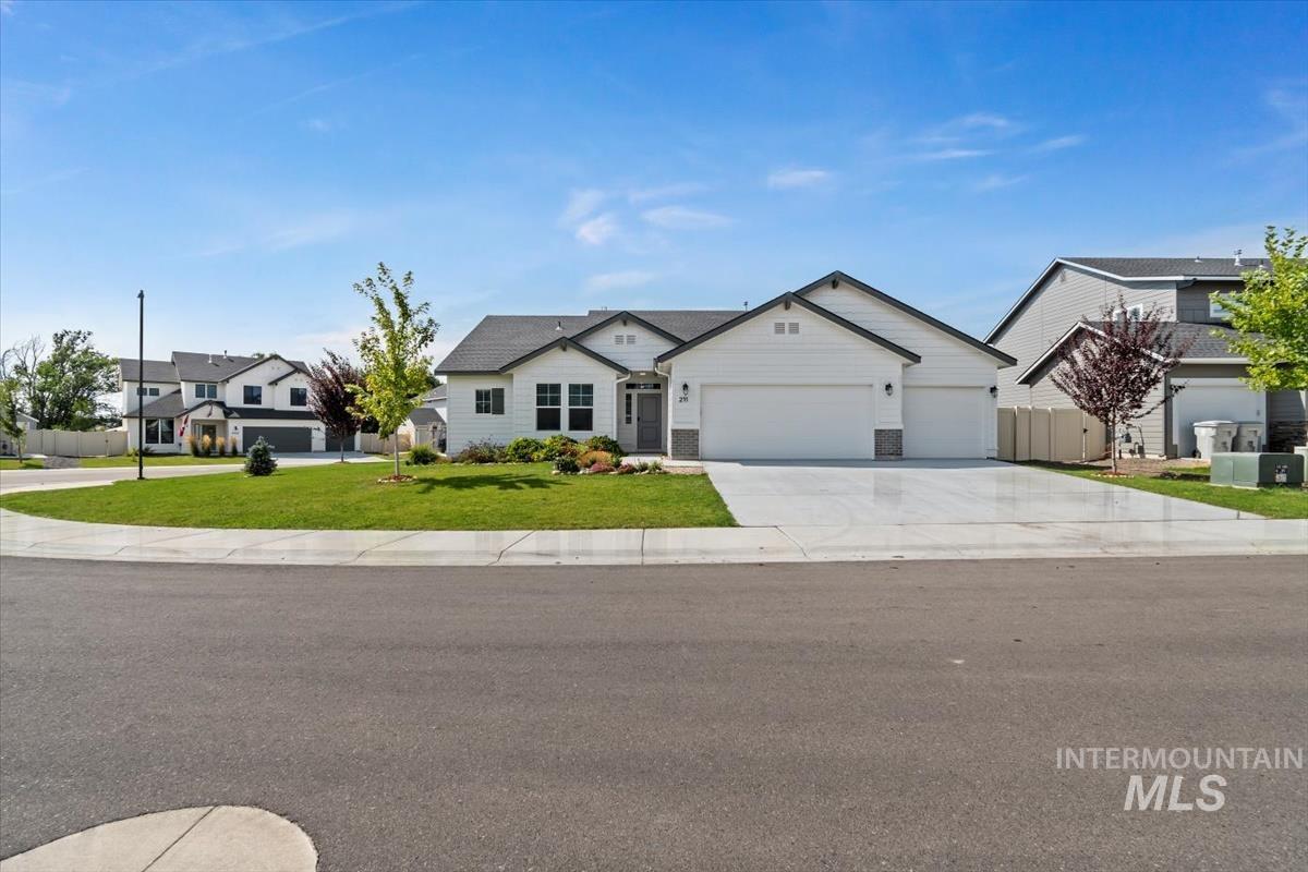 Single story home with a garage and driveway