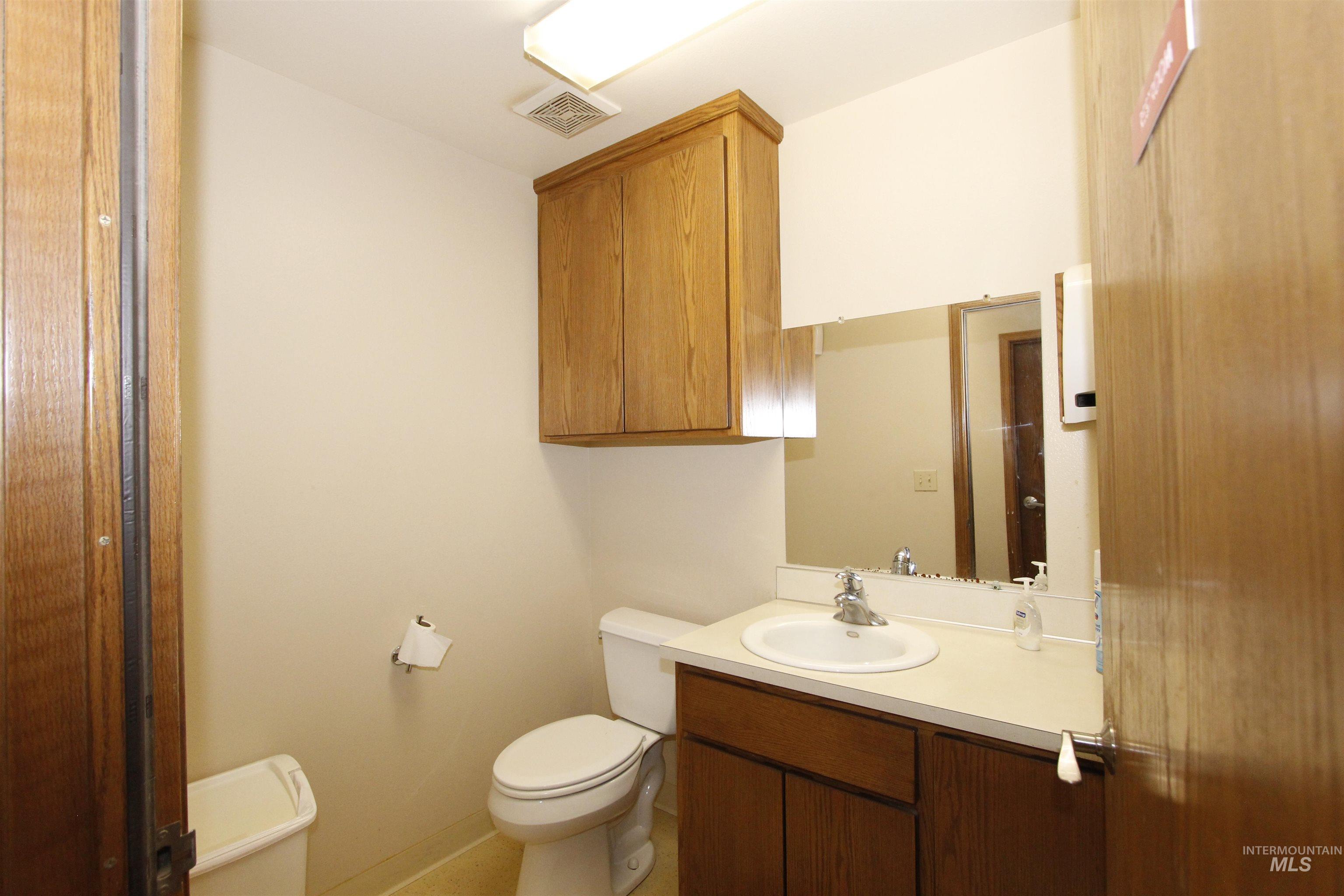 Half bath with toilet and vanity