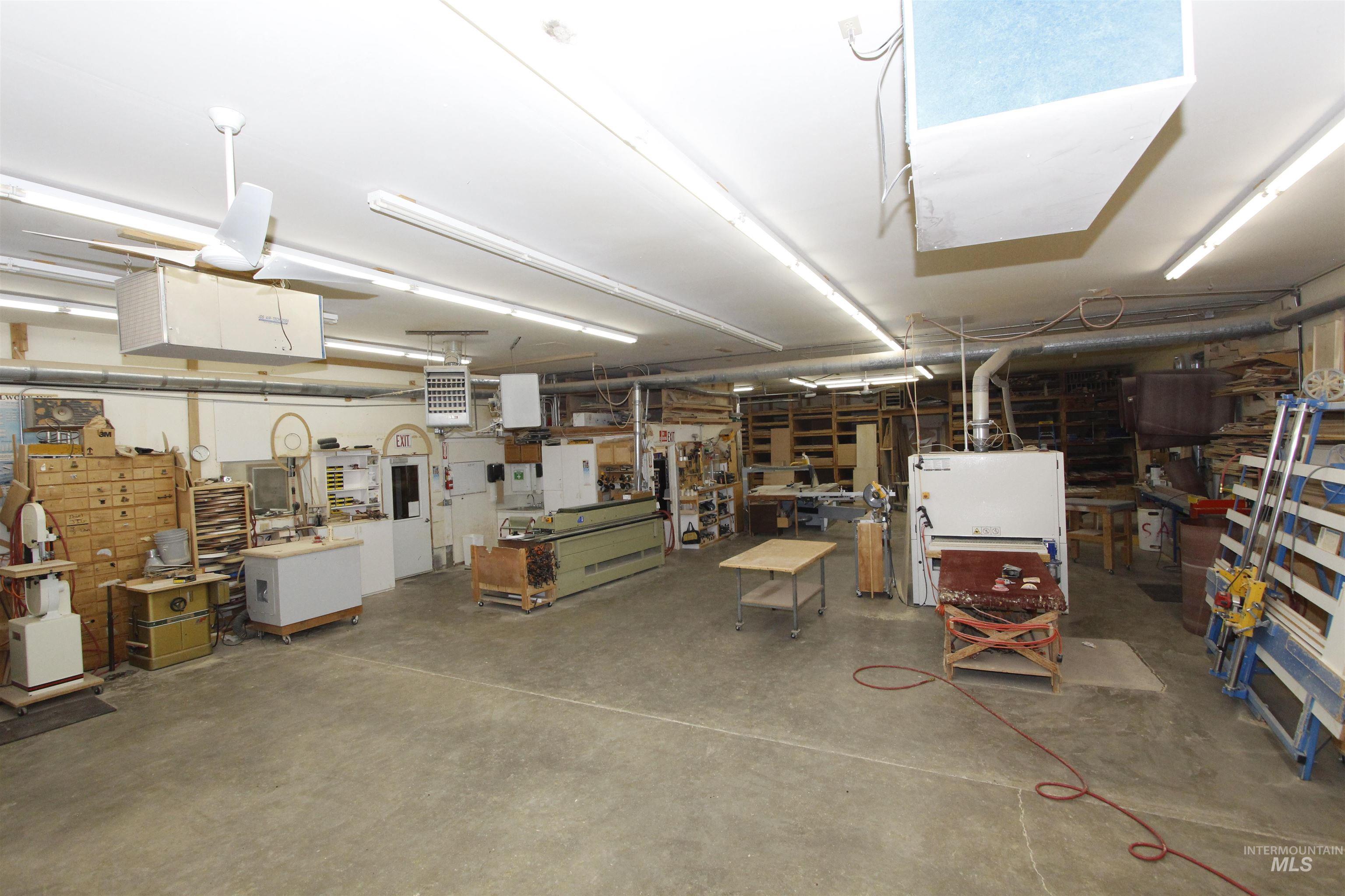 Garage with a heating unit and a workshop area