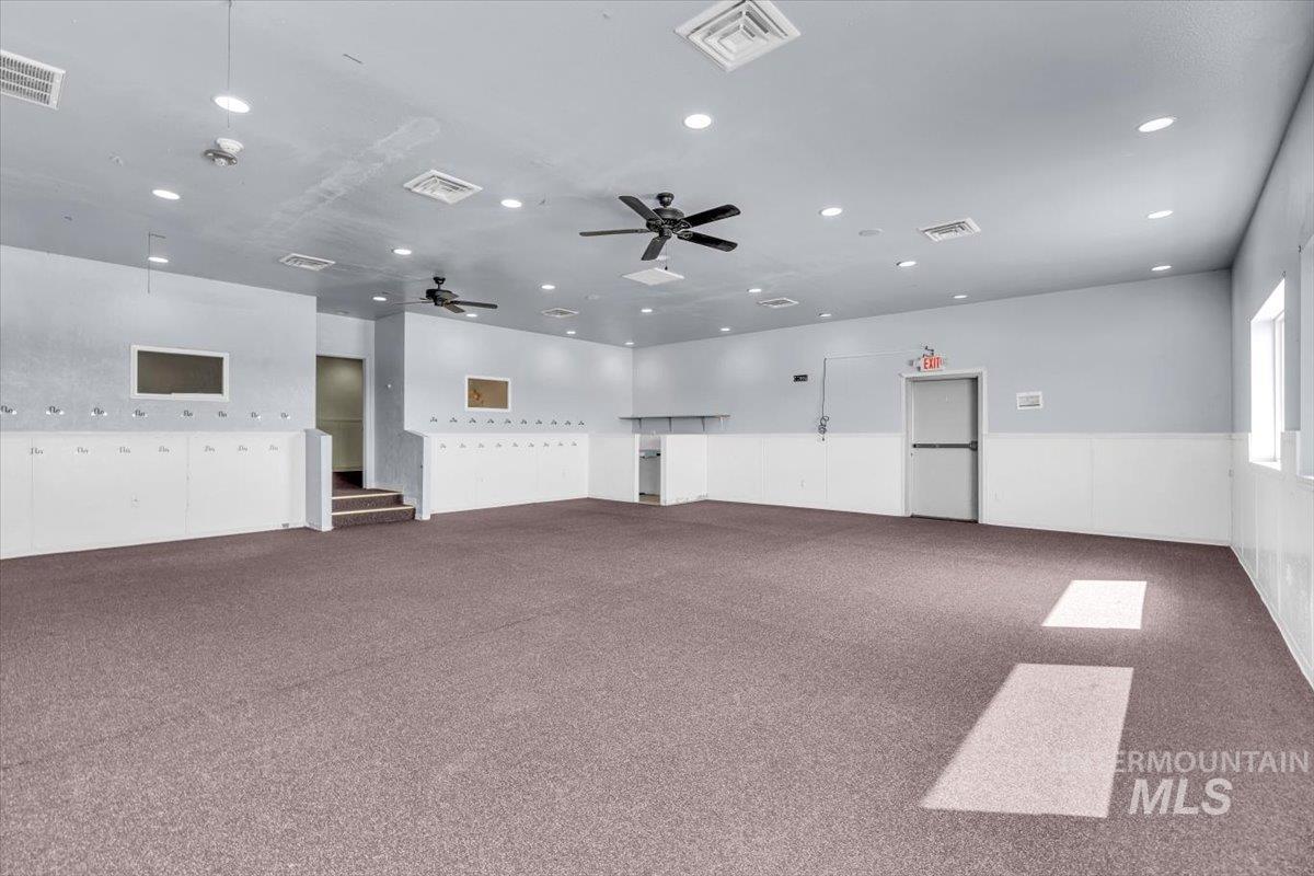 Empty room with carpet flooring, a ceiling fan, and recessed lighting