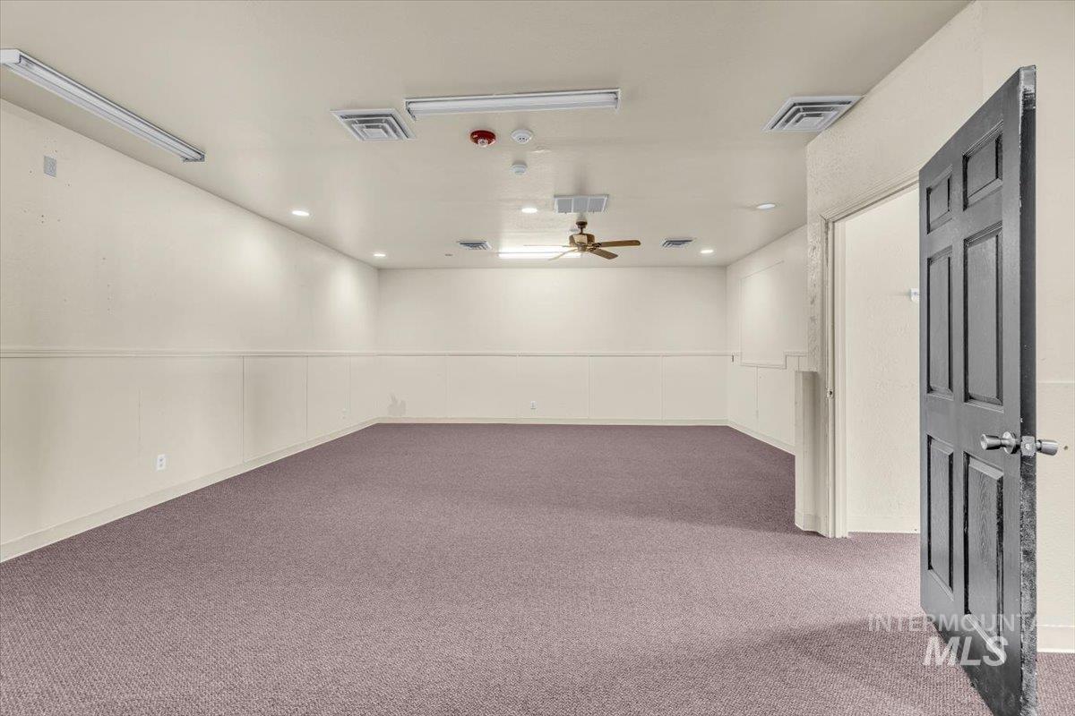 Unfurnished room with carpet flooring, ceiling fan, and recessed lighting
