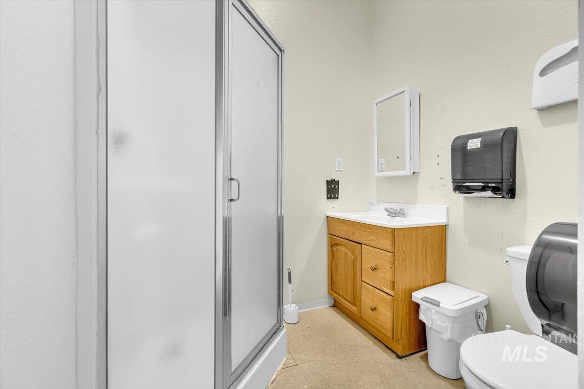 Bathroom with a shower stall and vanity