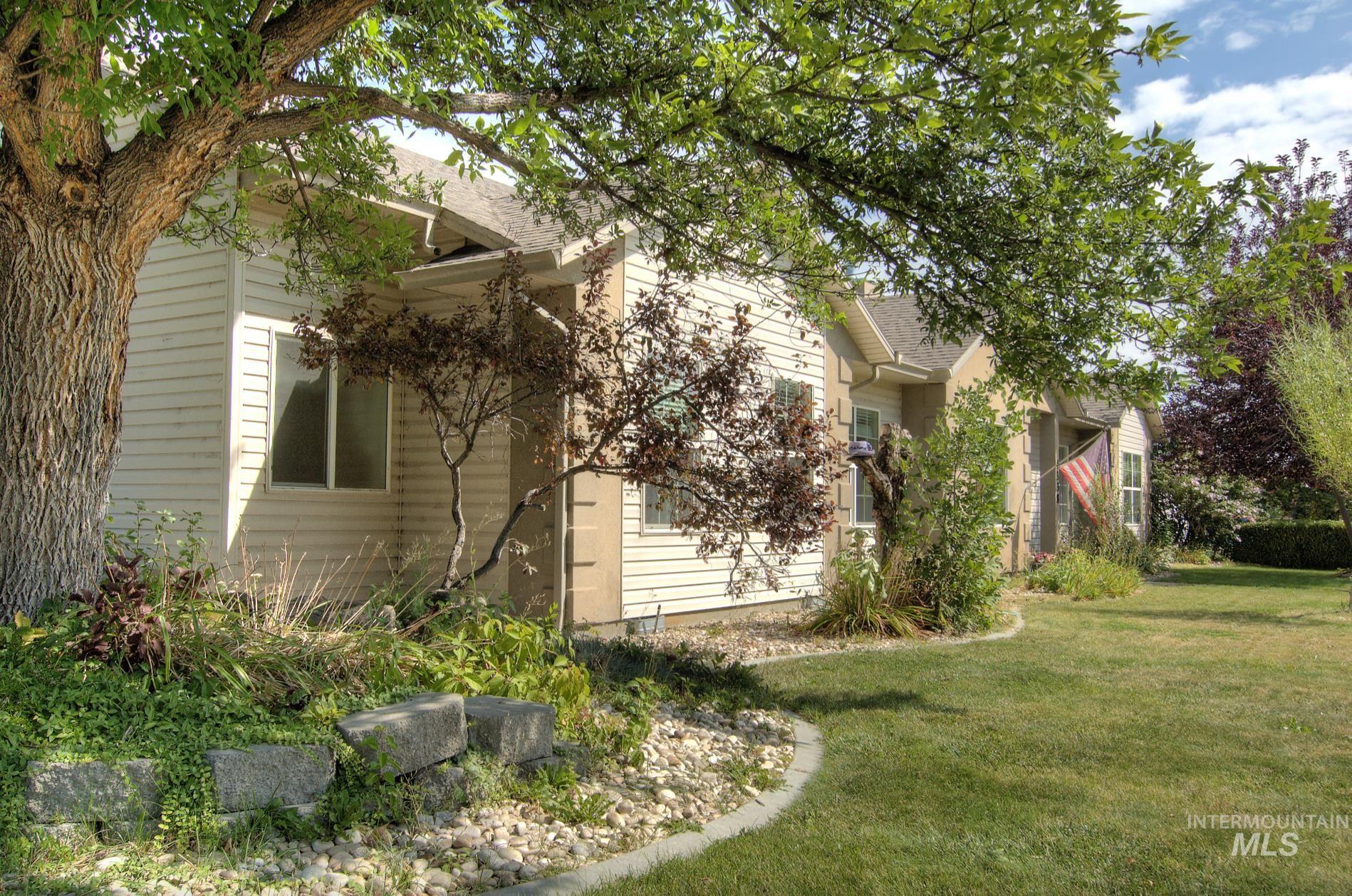View of side of home featuring a yard