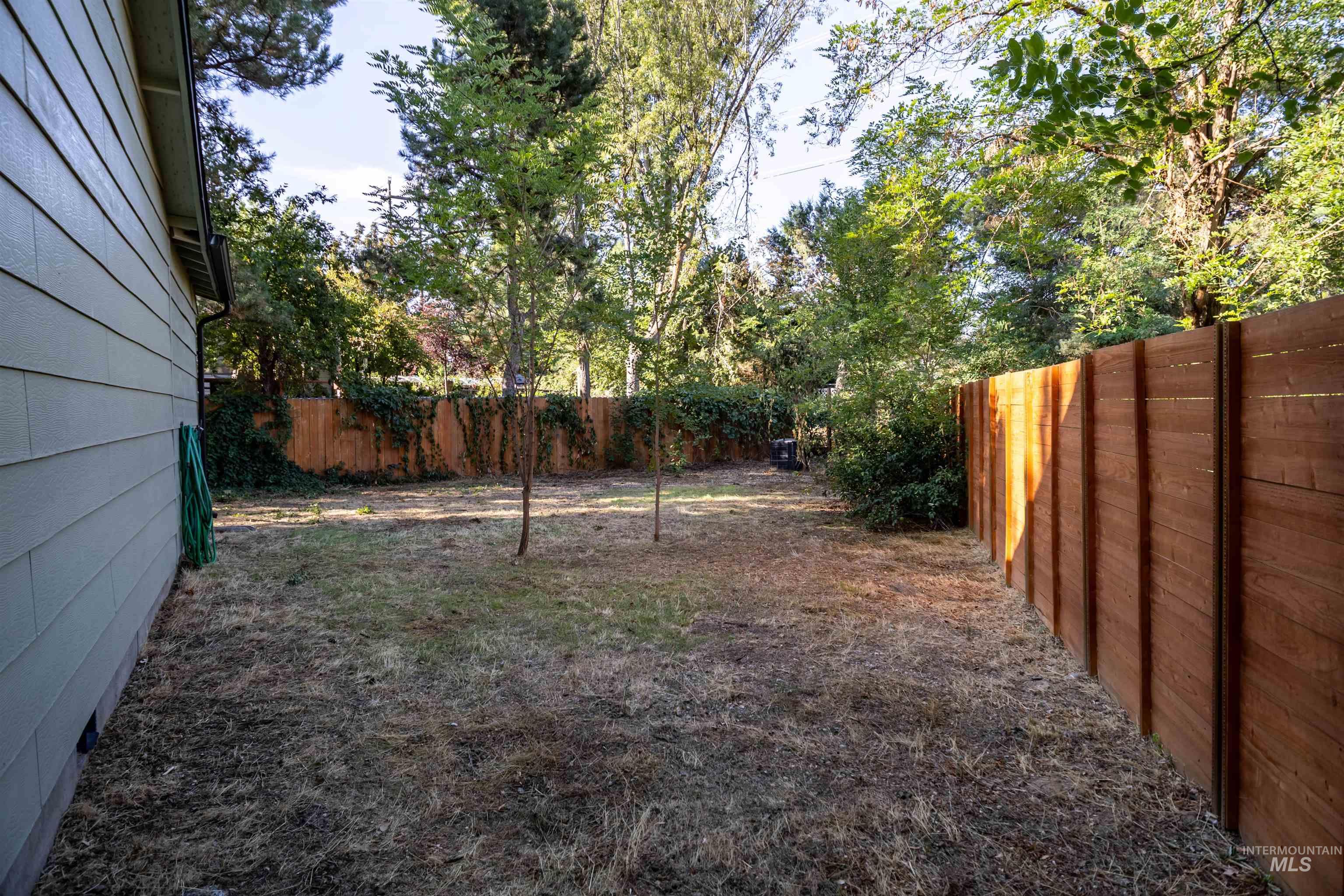 View of fenced backyard