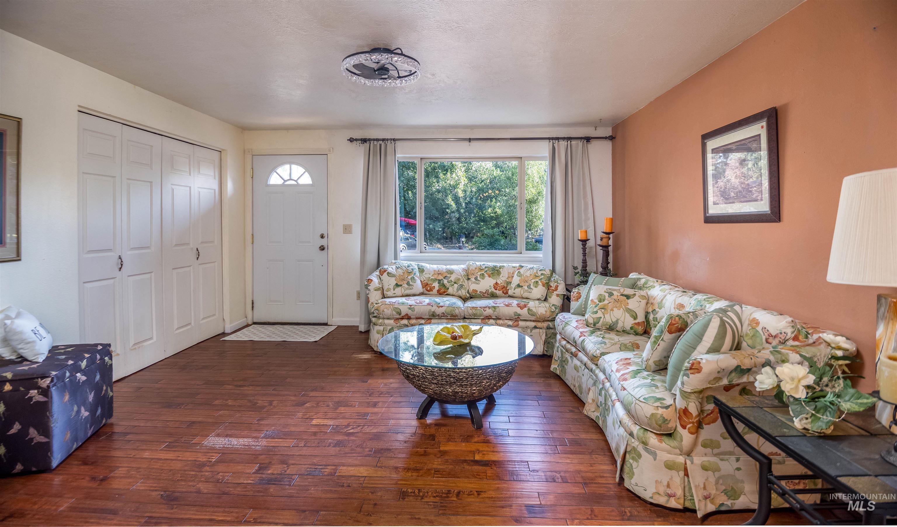 Living area with dark wood finished floors