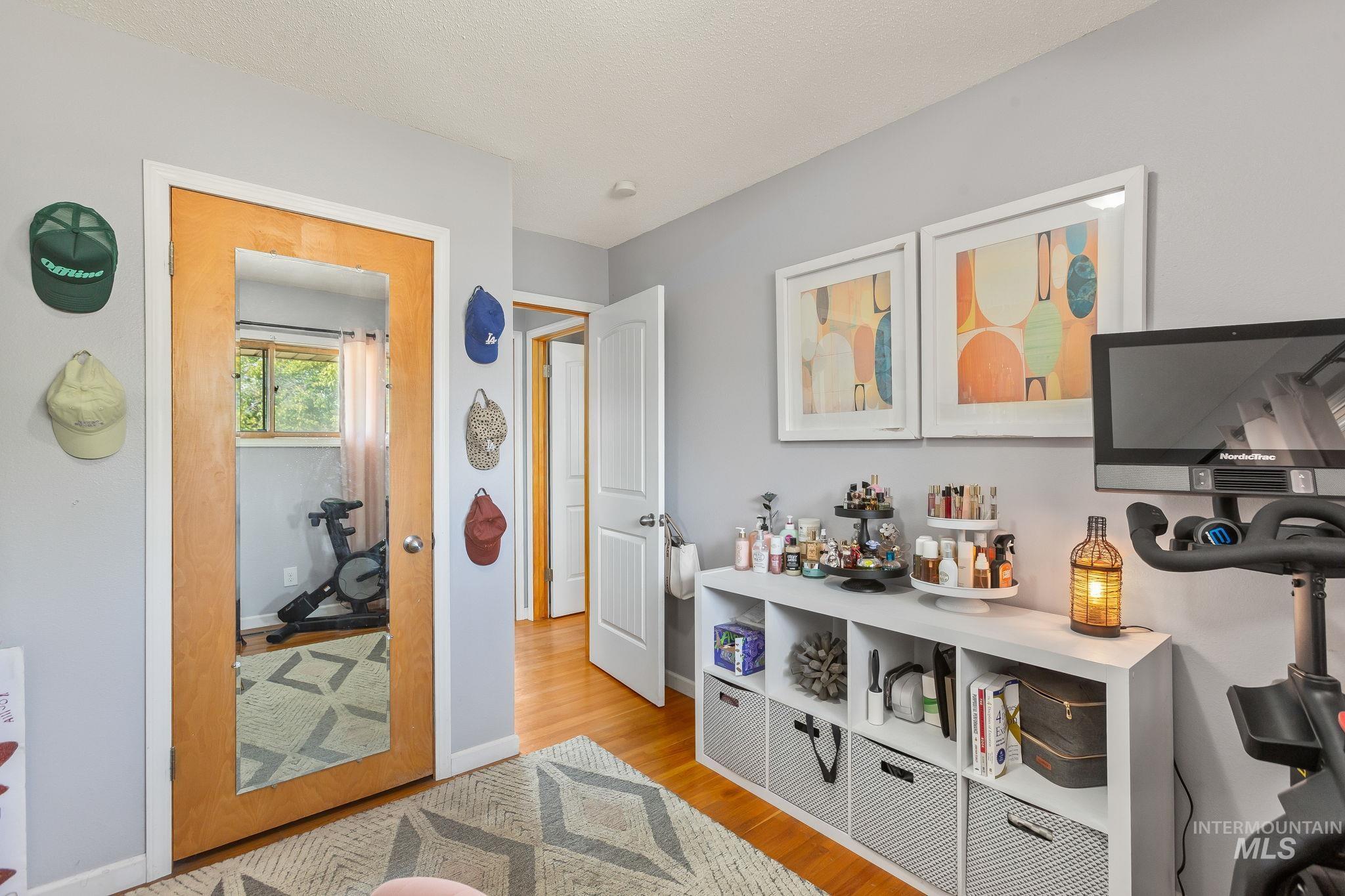 Bedroom featuring light wood-type flooring and baseboards
