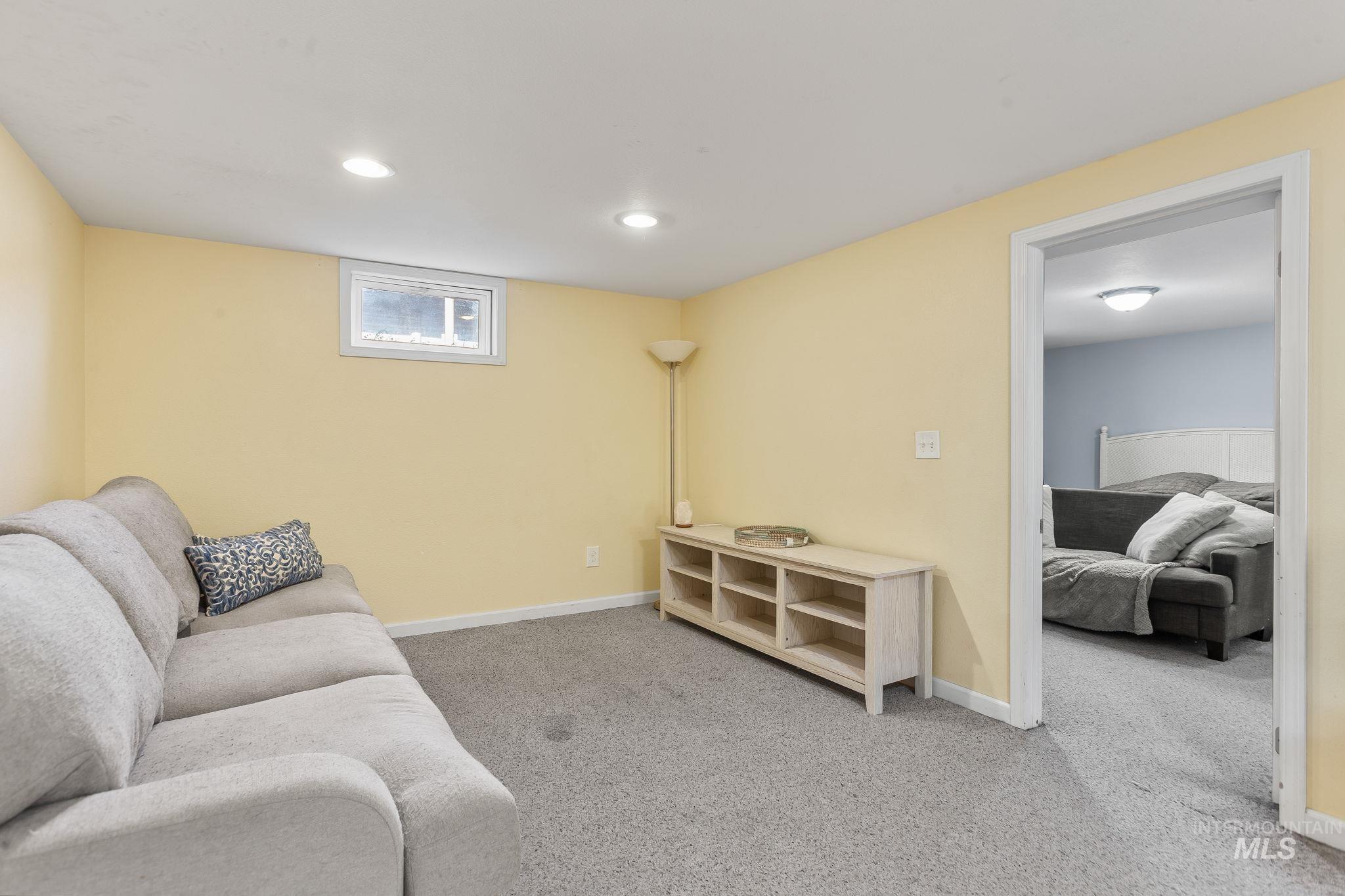 Living room with carpet and recessed lighting