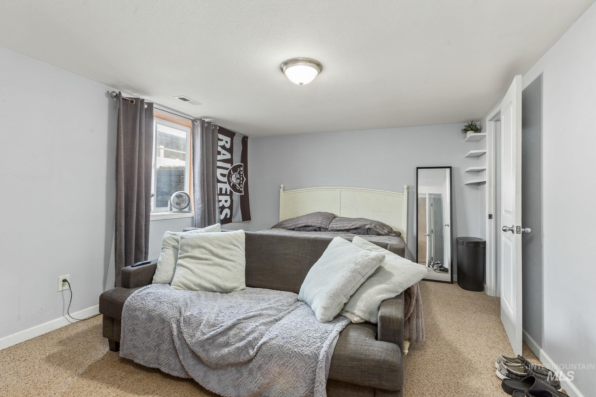 Bedroom with light carpet
