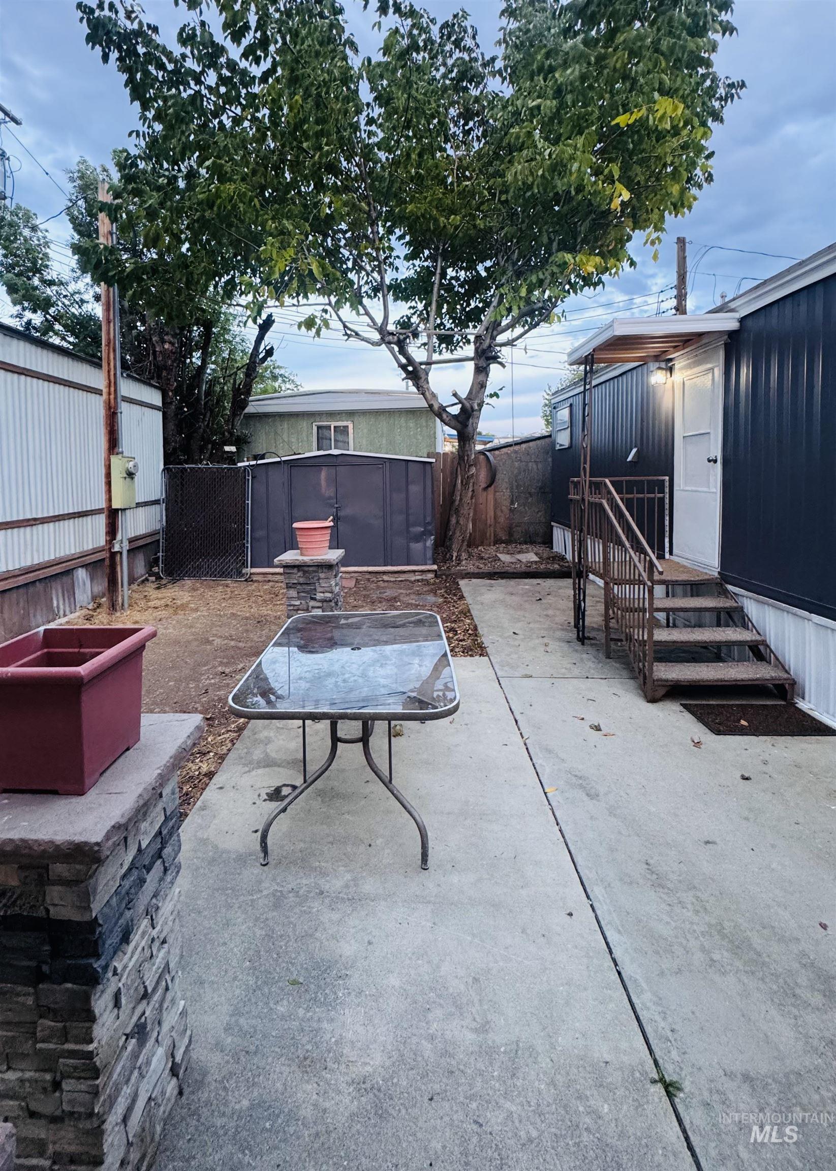 Fenced backyard with a patio