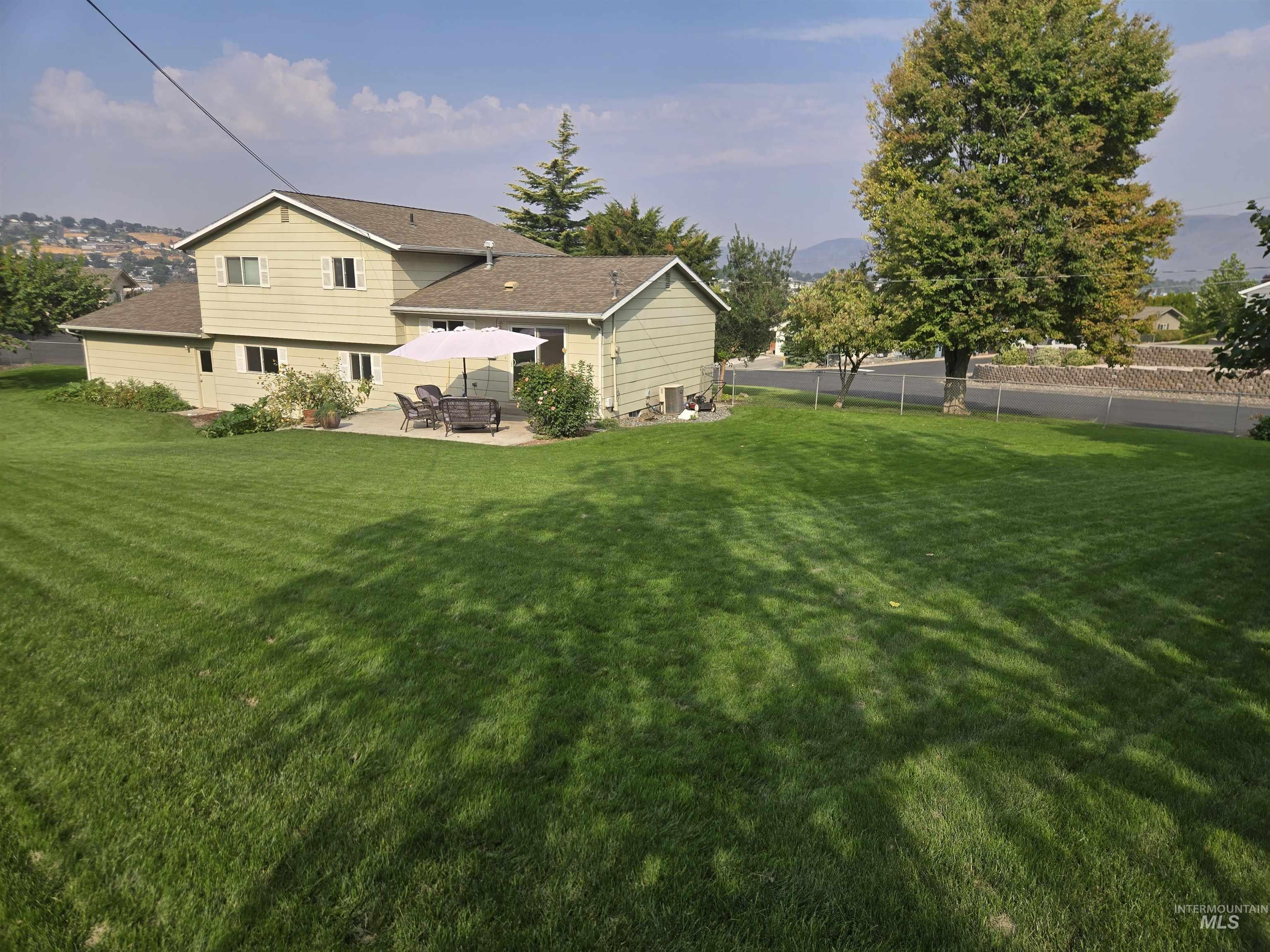 Back of property with a patio area