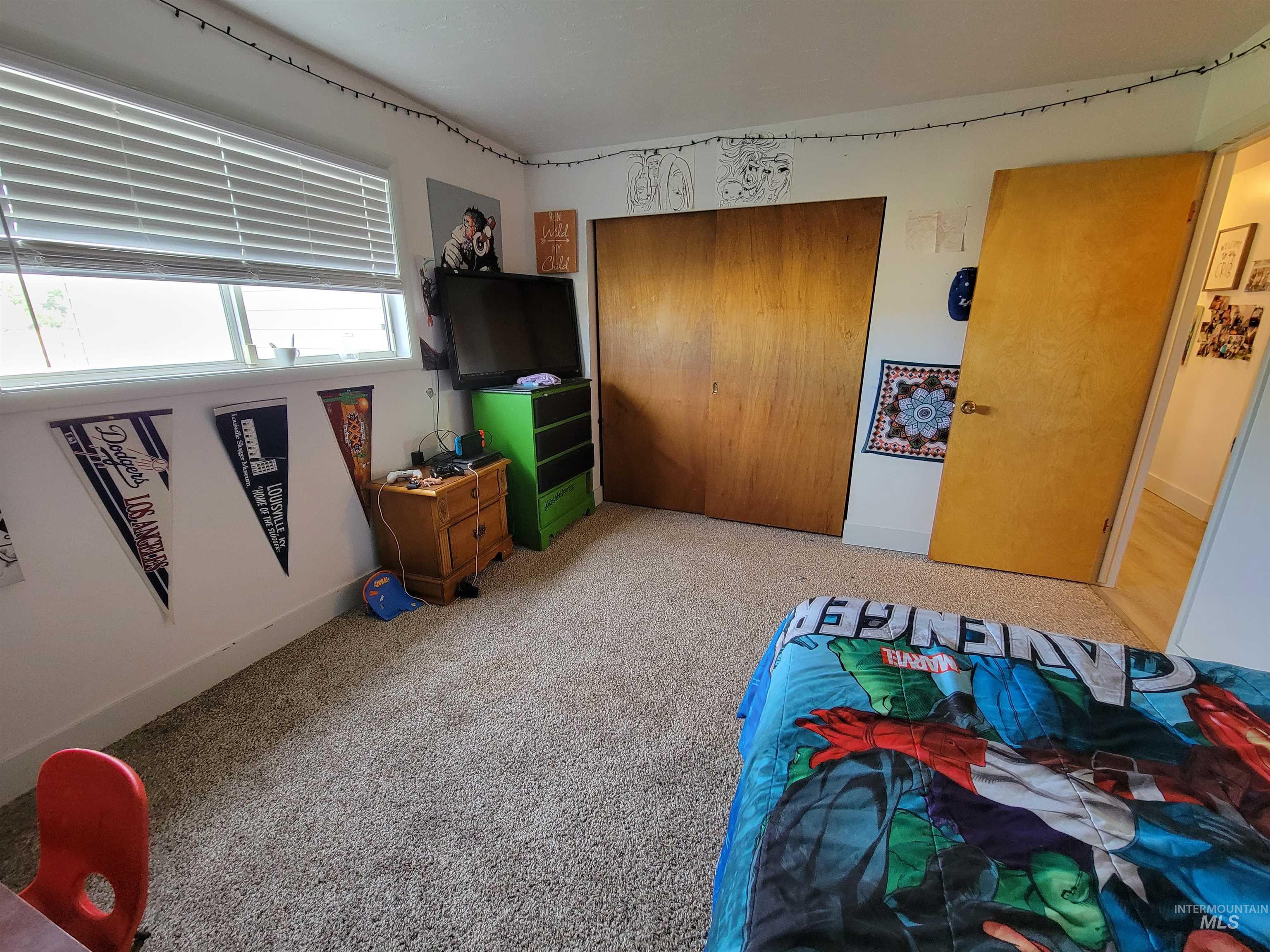 Bedroom with carpet flooring and a closet