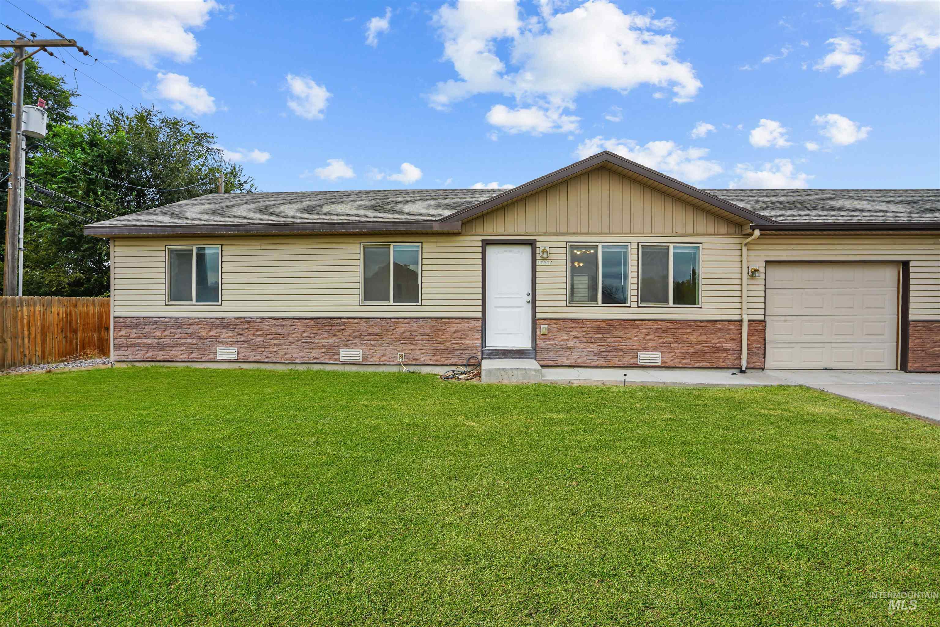 Ranch-style house with crawl space, an attached garage, and roof with shingles