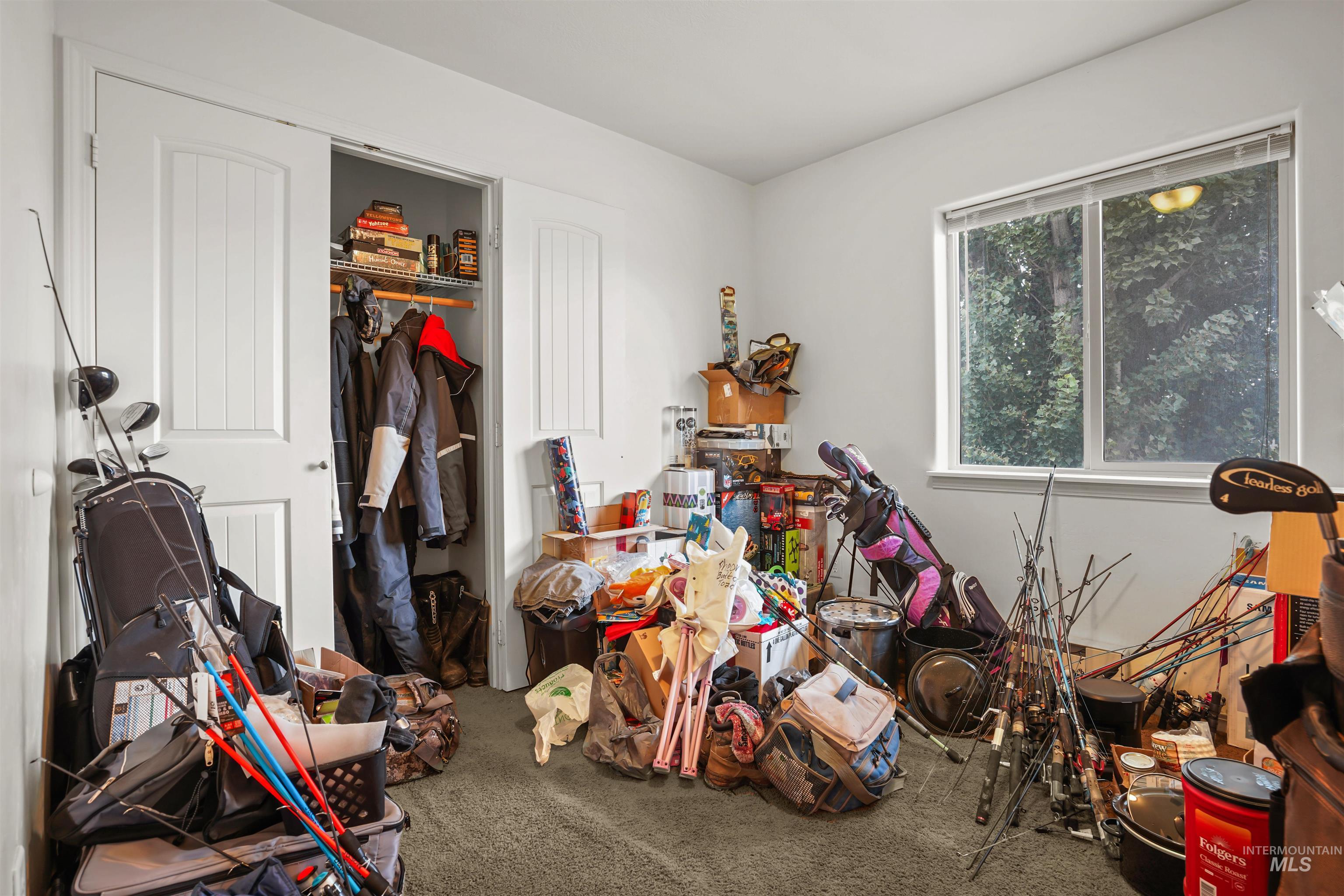 Bedroom with carpet and a closet