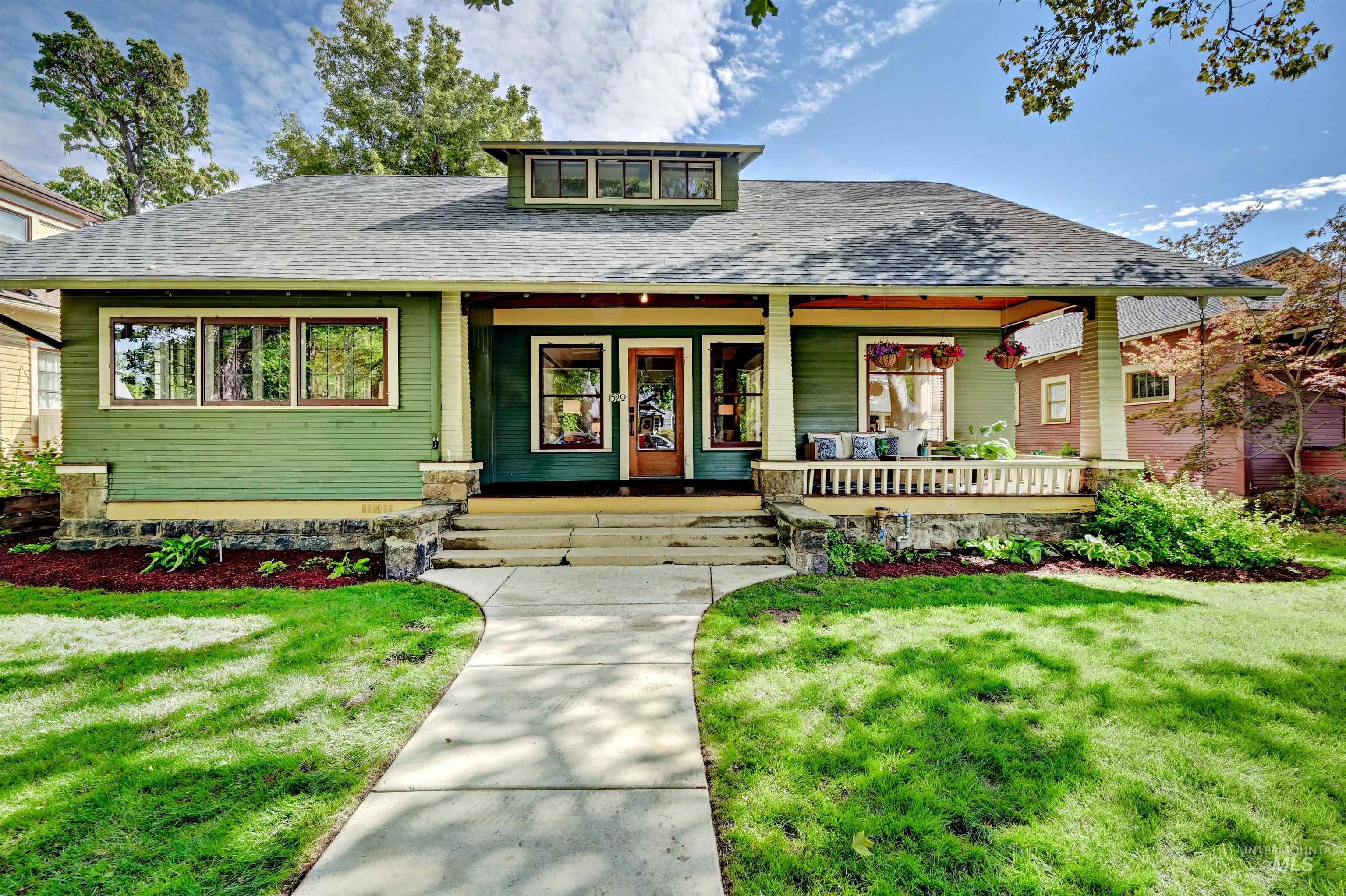 Historic Craftsman bungalow with an amazing front porch, perfect for visiting with neighbors as they stroll by on the sidewalk.