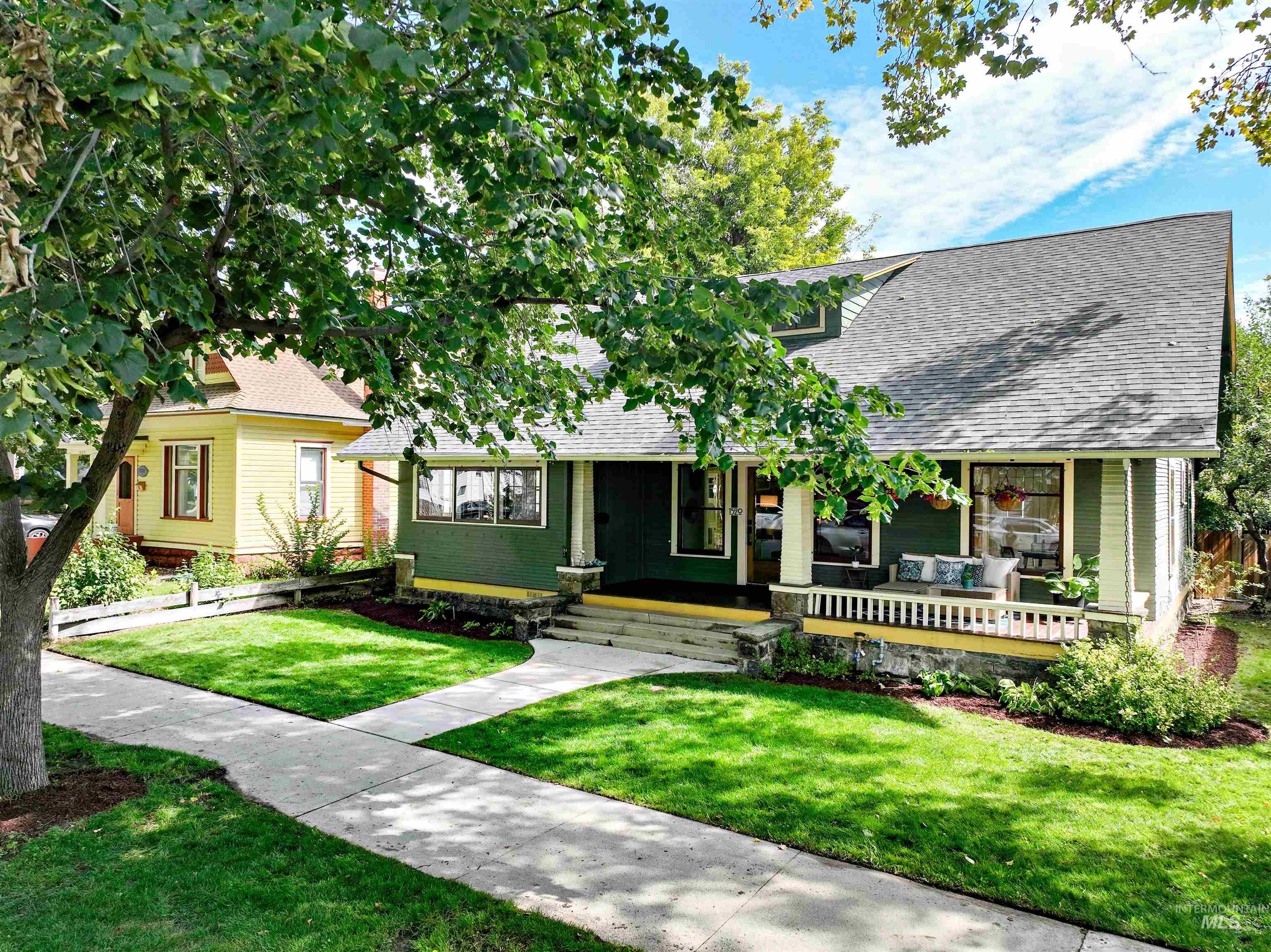 Historic Craftsman bungalow with an amazing front porch, perfect for visiting with neighbors as they stroll by on the sidewalk.