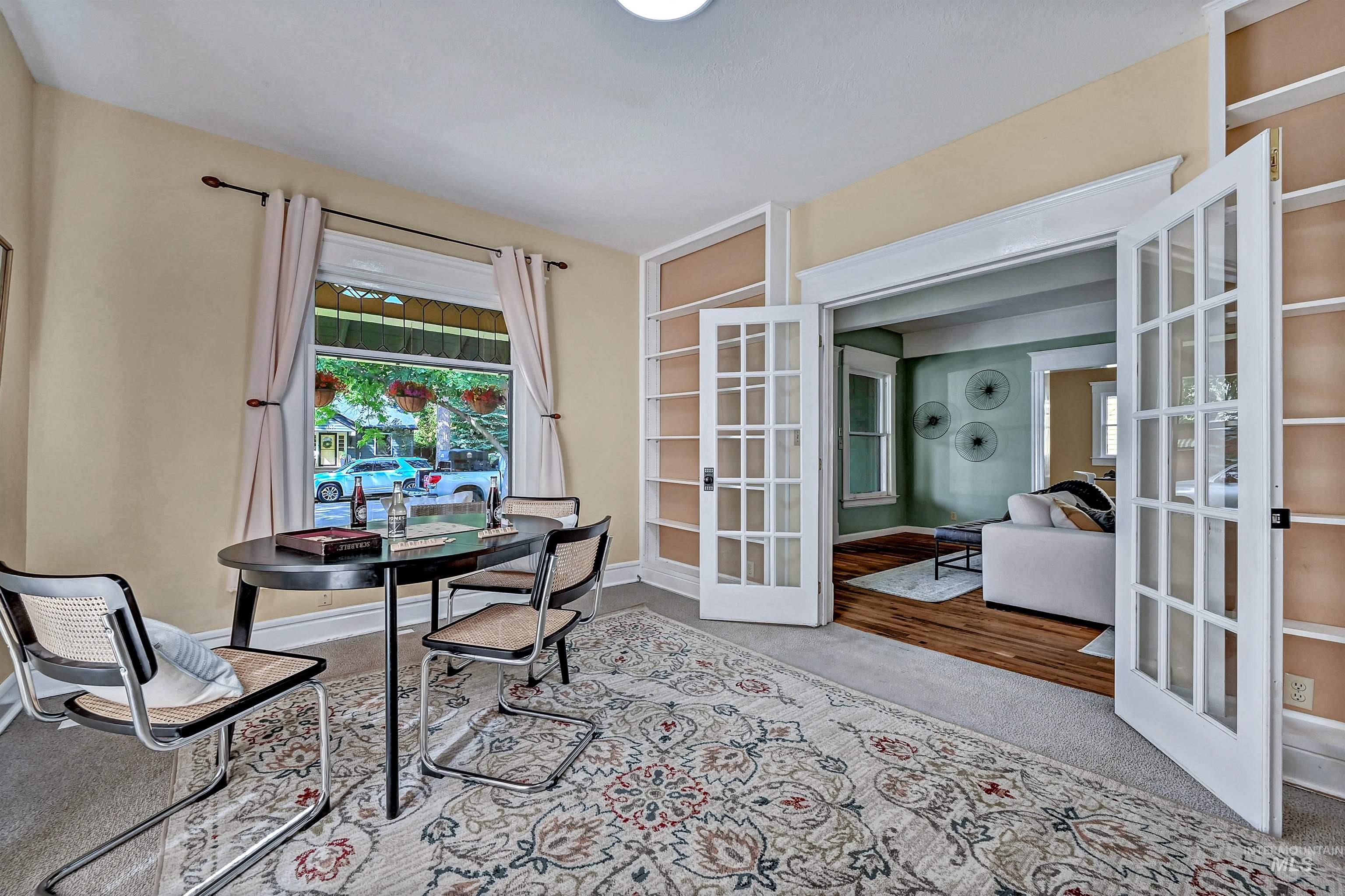 Family room with French doors, could also be a main-floor 5th bedroom