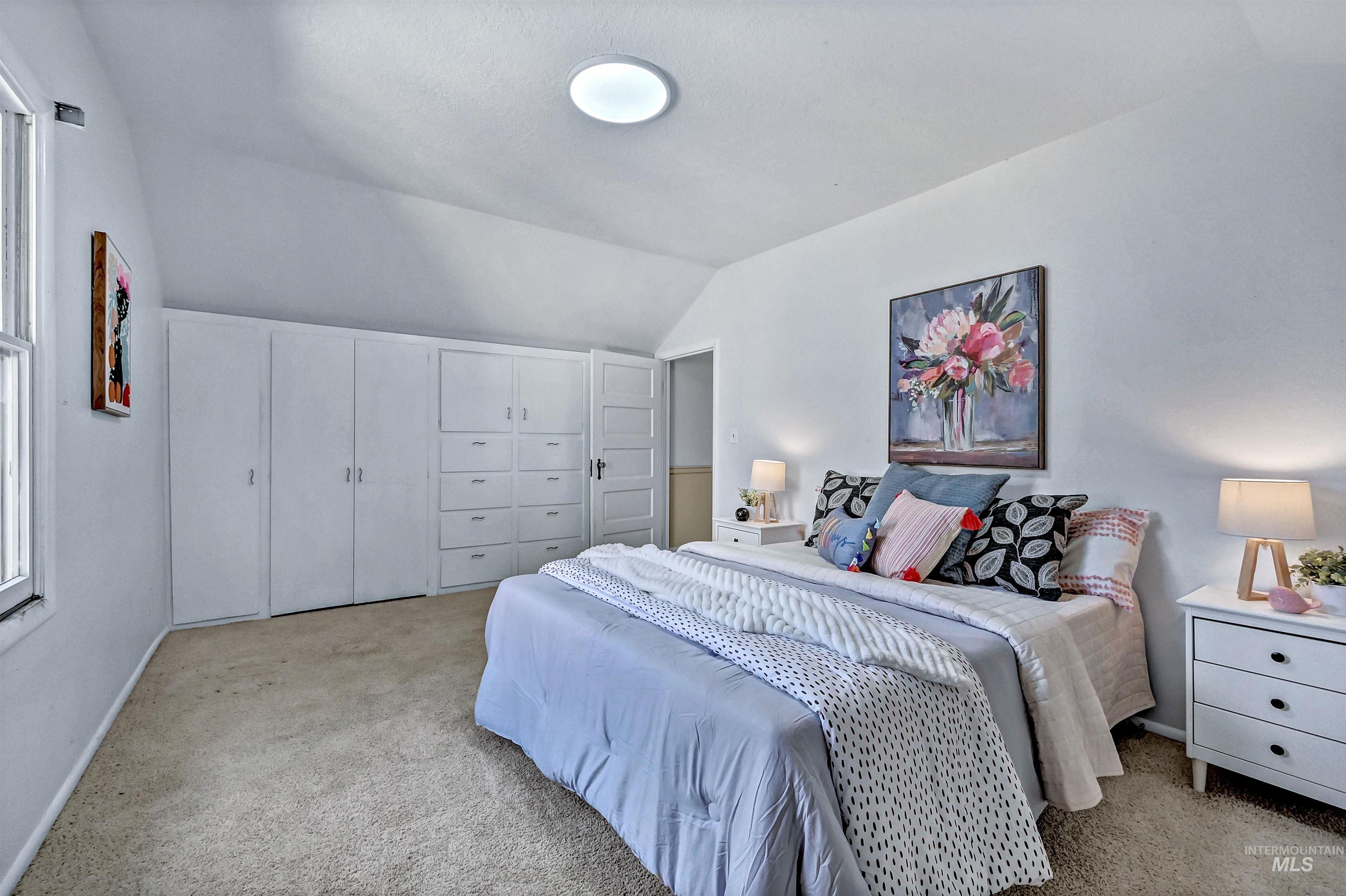 Upstairs bedroom with built-in cabinets