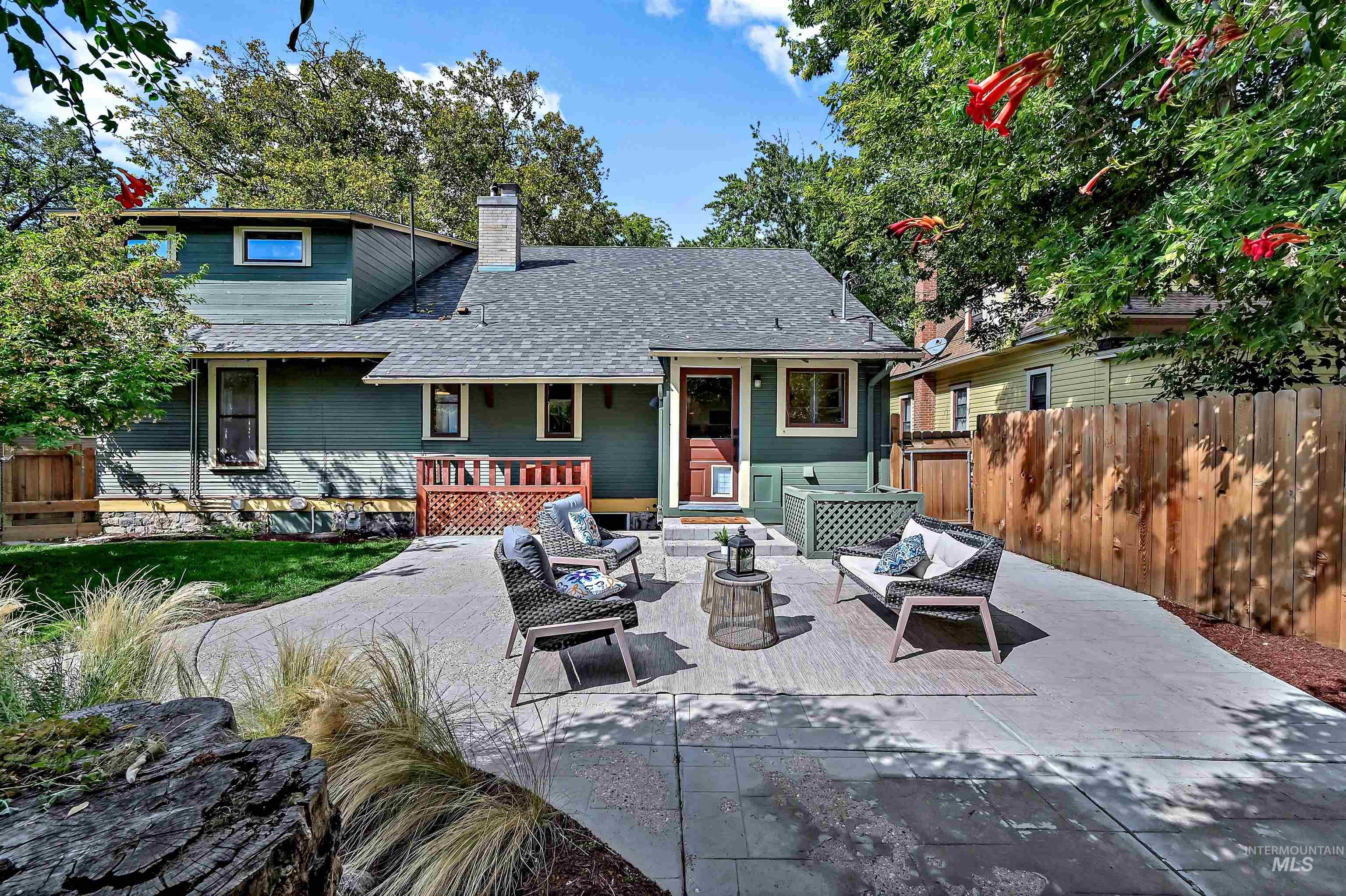 Rear view of house with outdoor lounge area, a patio area, and a new roof.
