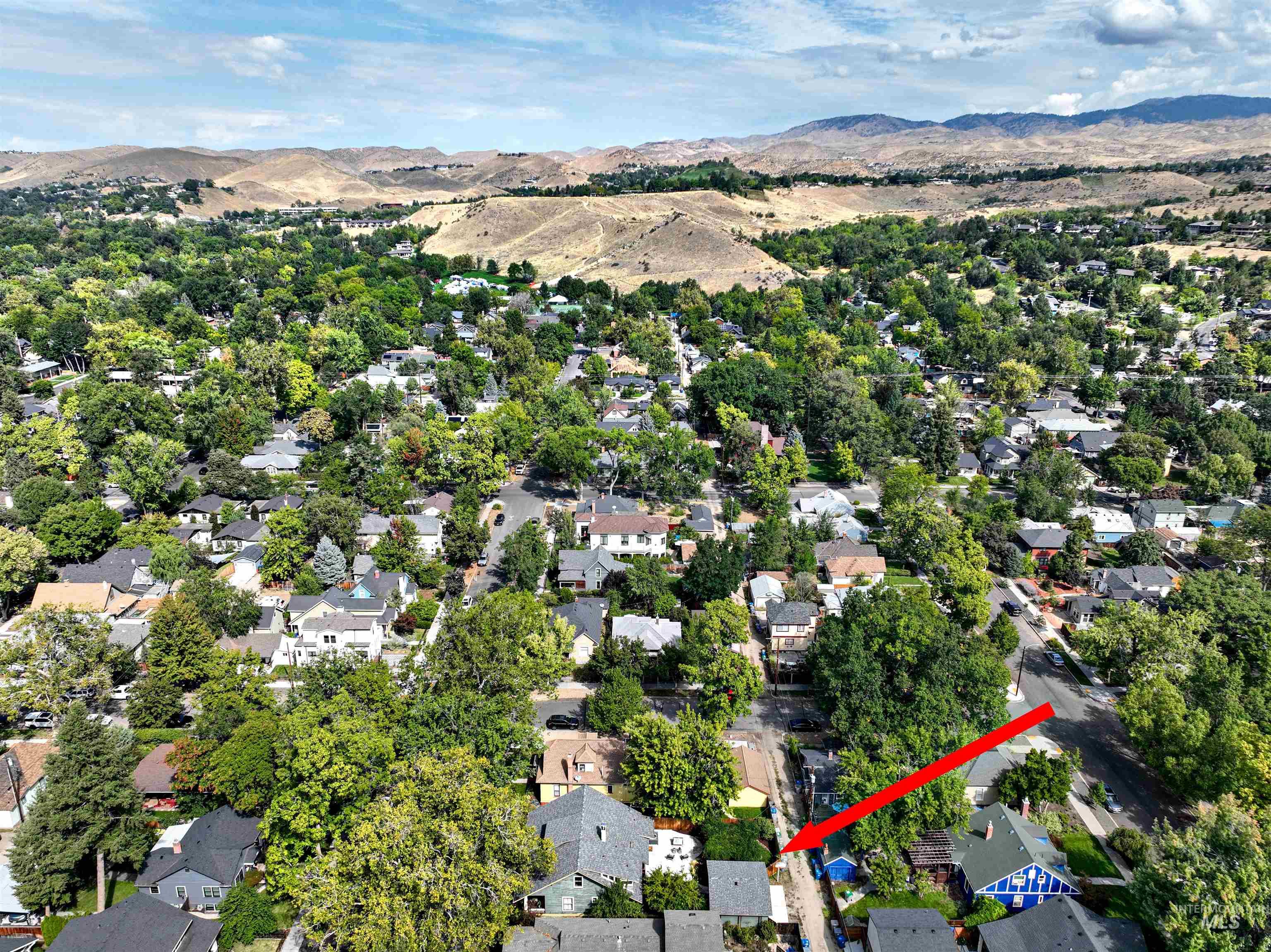 Aerial overview showing the home's location relative to Camel's Back Park and foothills trails