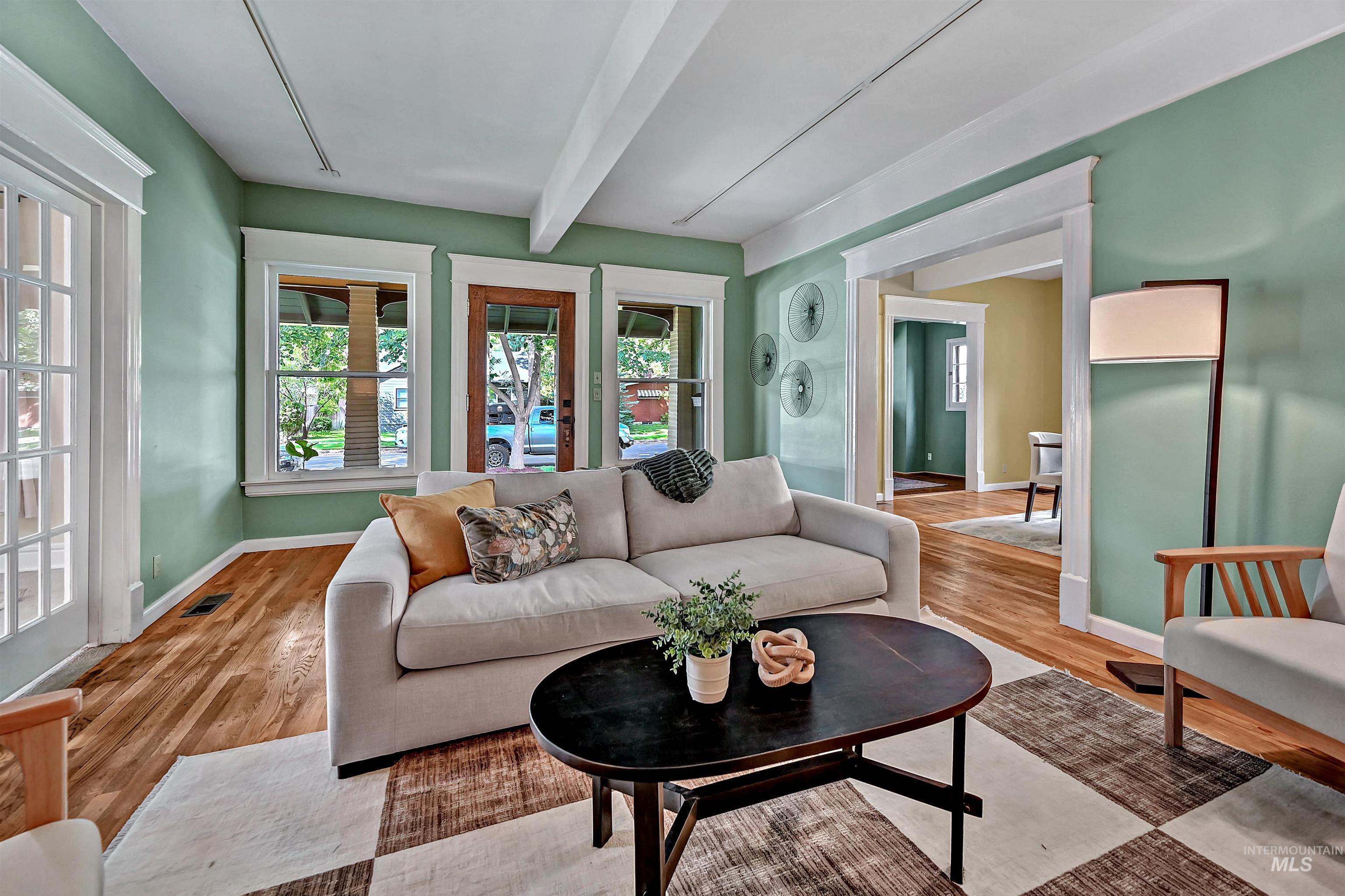 Living room from the fireplace looking out to the amazing front porch!