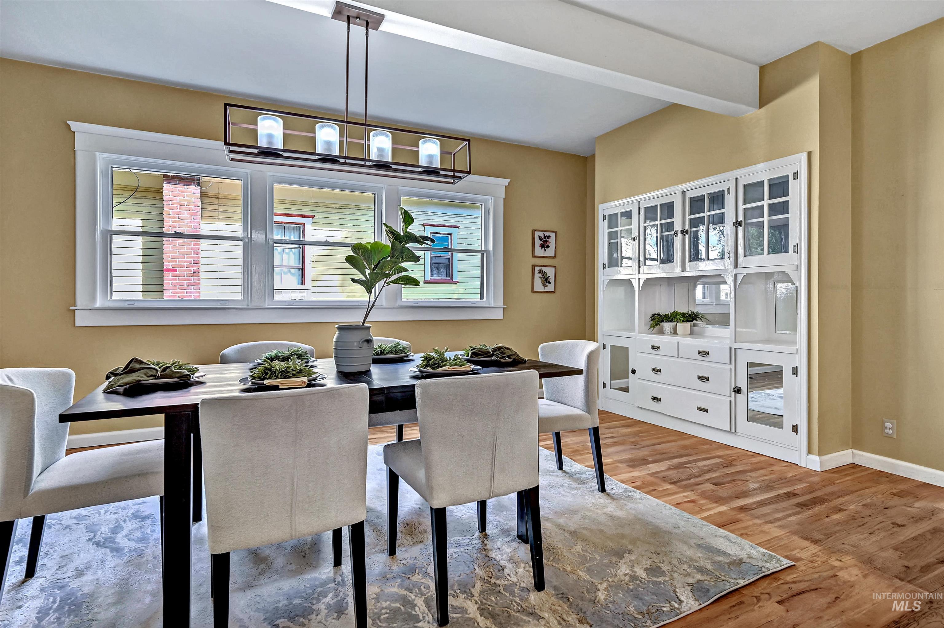 Huge dining room with original built-in cabinets and wood floors.