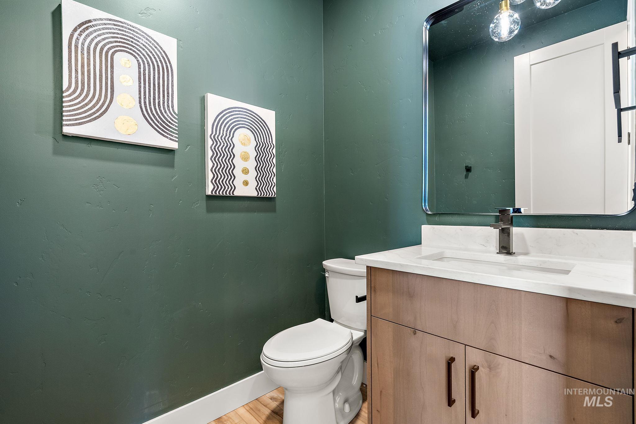 Bathroom with vanity and light wood-style flooring
