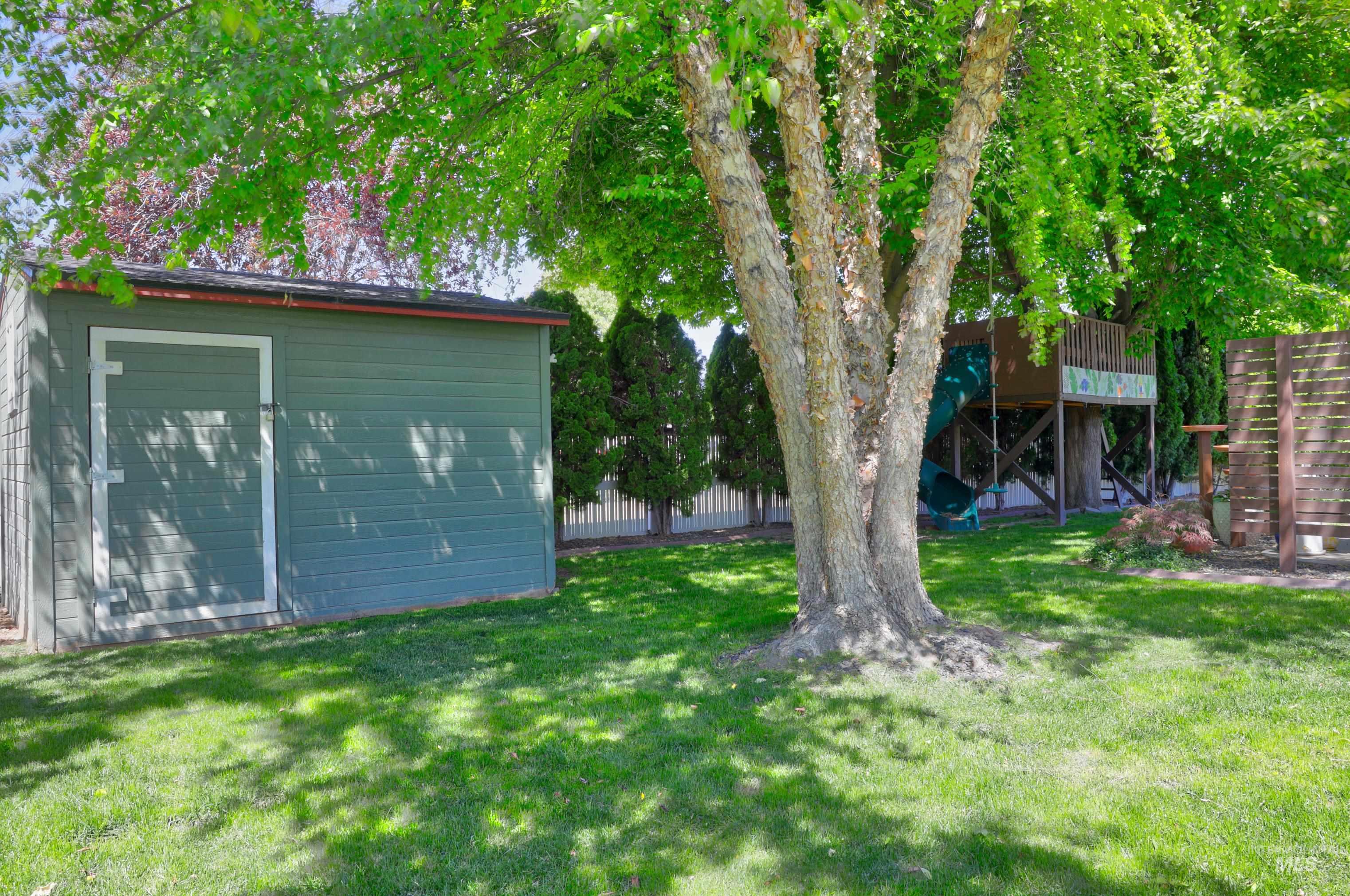 View of yard with a storage shed