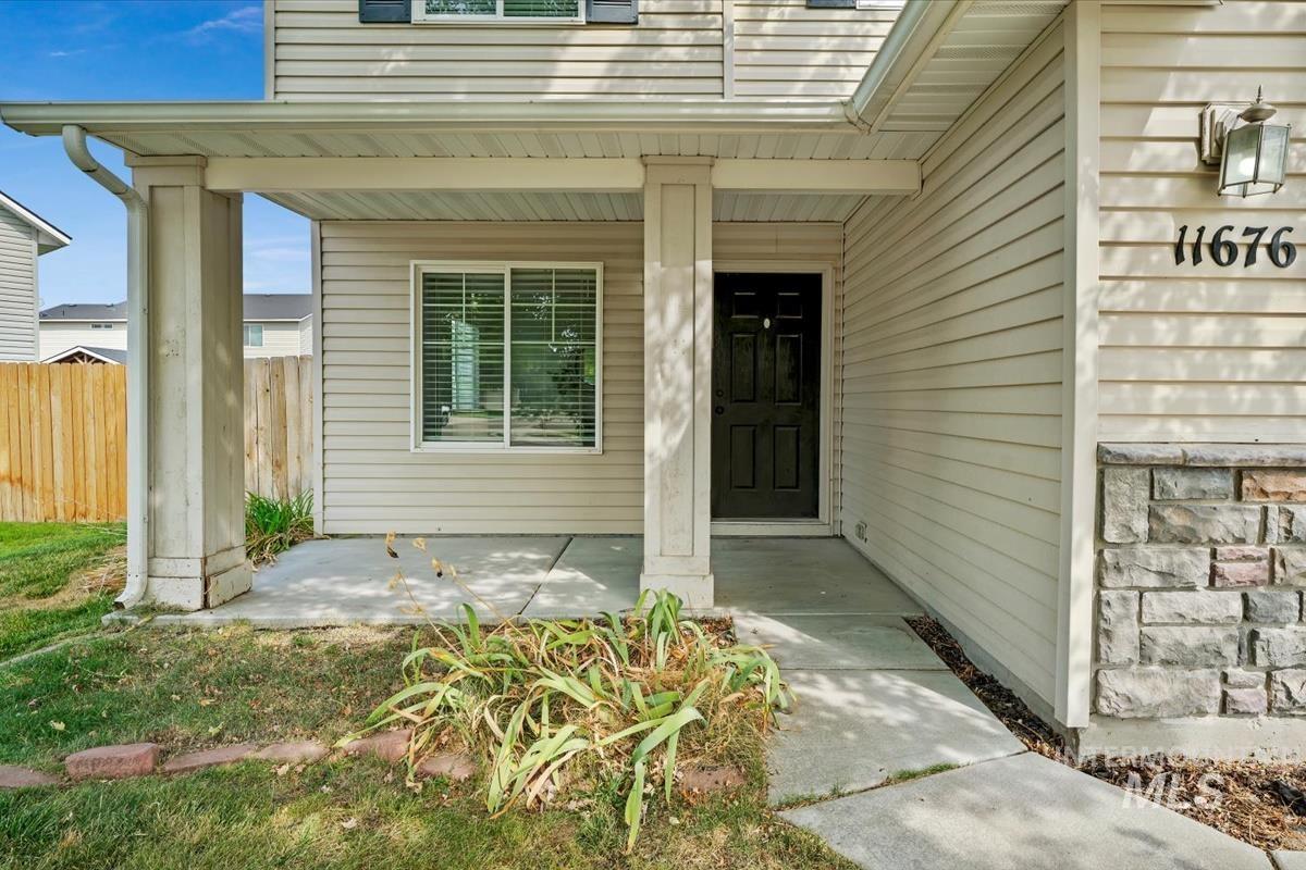 Doorway to property featuring a porch