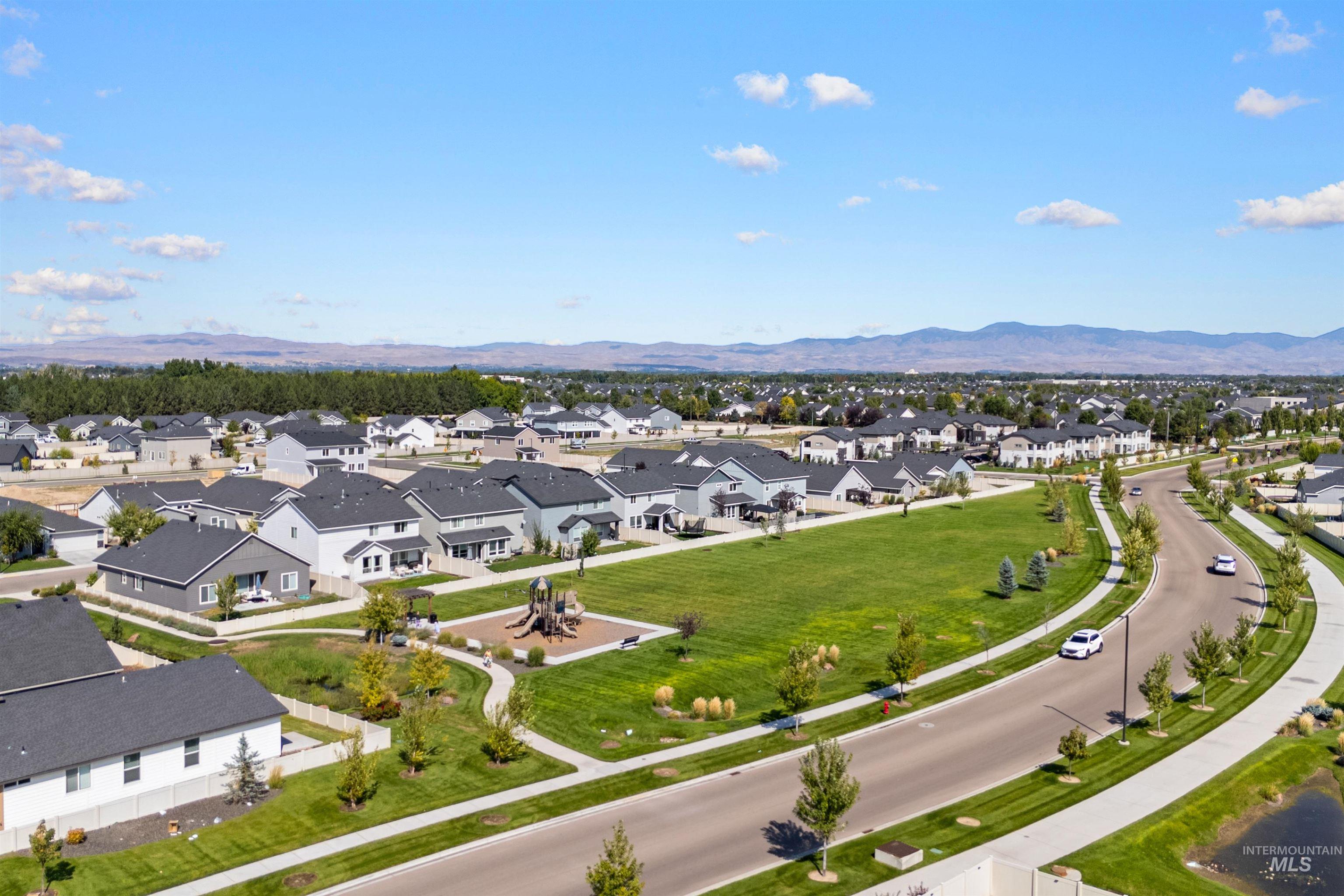 Aerial view of residential area with a mountain backdrop