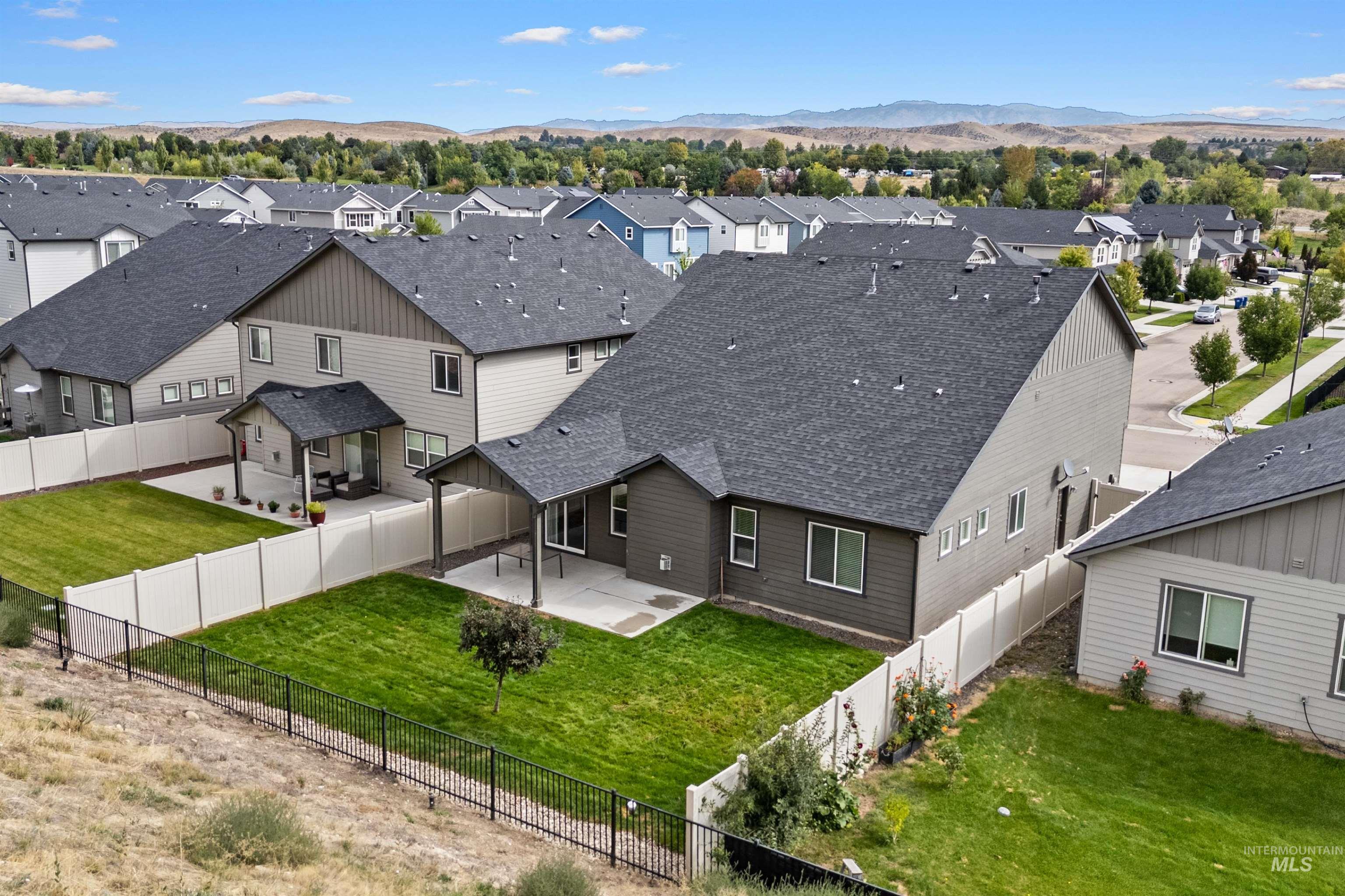 Aerial perspective of suburban area featuring mountains