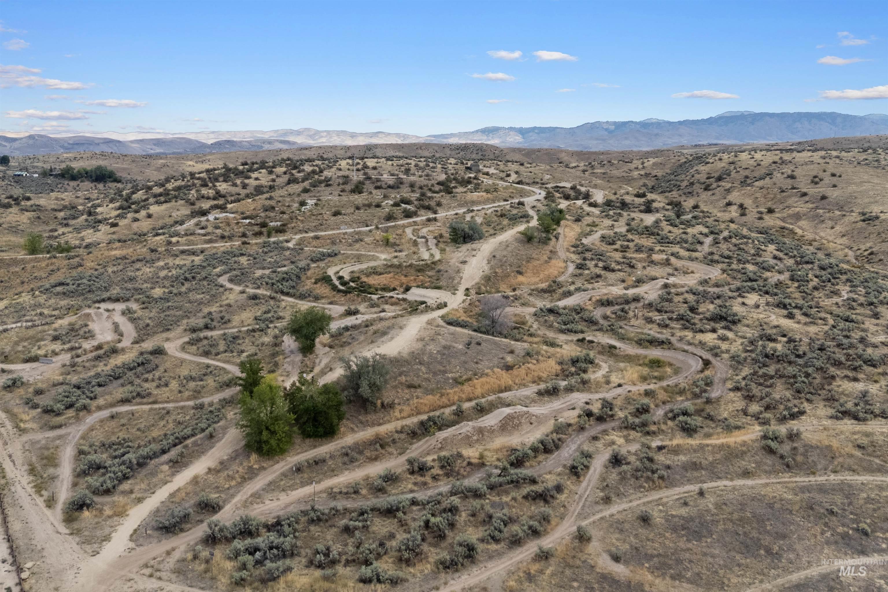 View of property location with a mountainous background and rural landscape