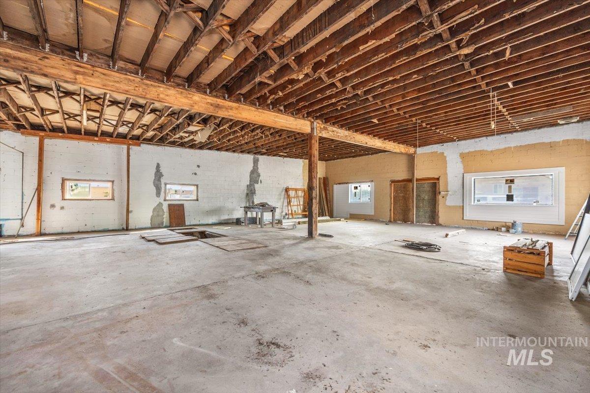 Misc room with unfinished concrete floors