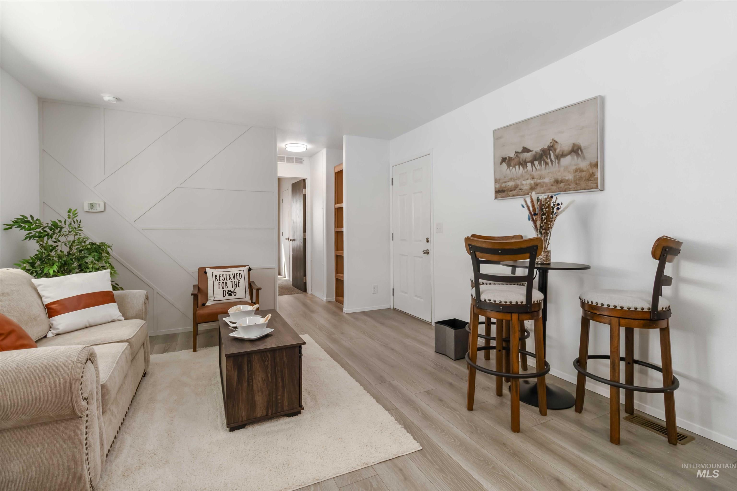 Sitting room with light wood finished floors and baseboards