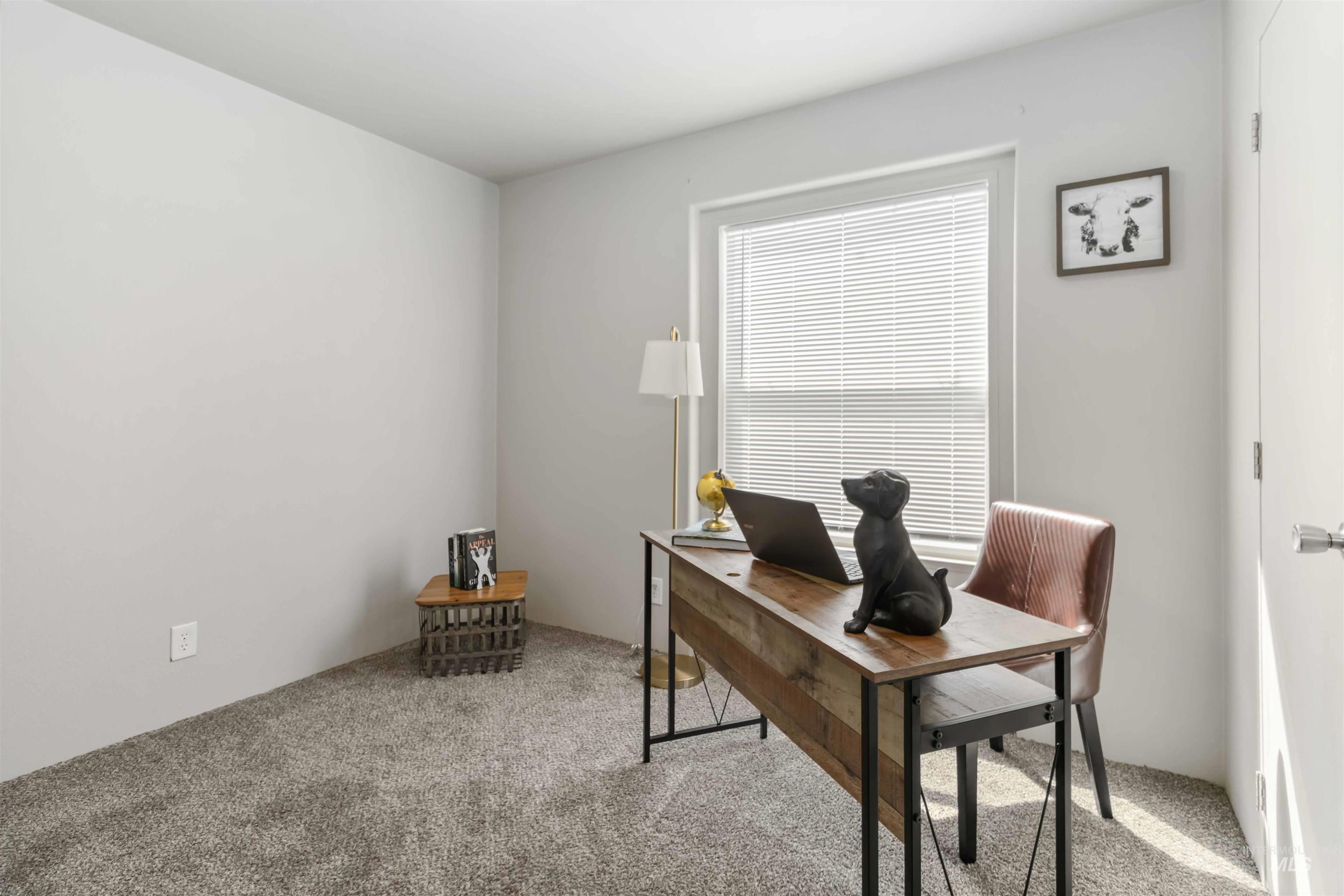 Office space featuring light colored carpet
