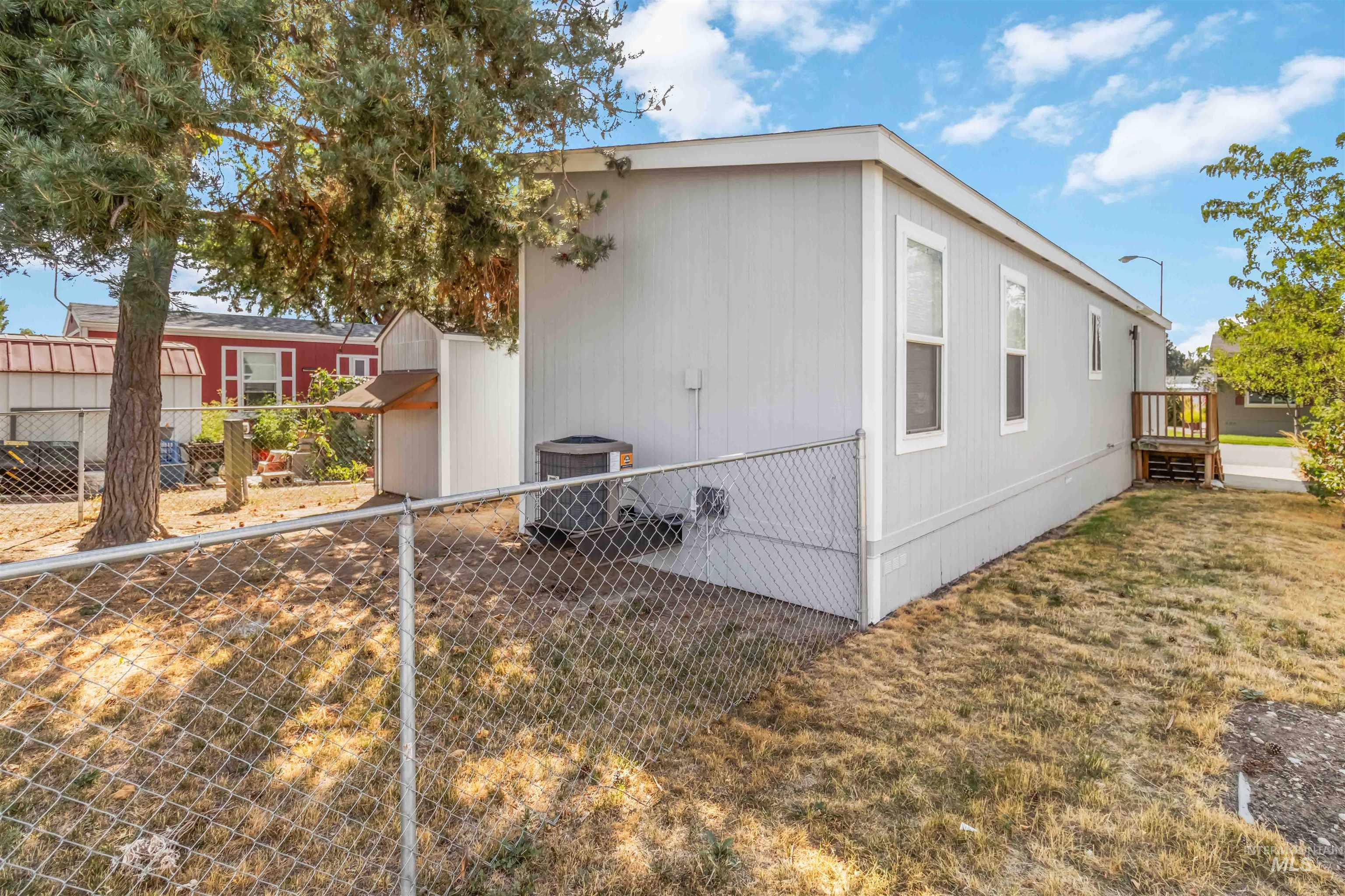 View of property exterior with a central AC unit