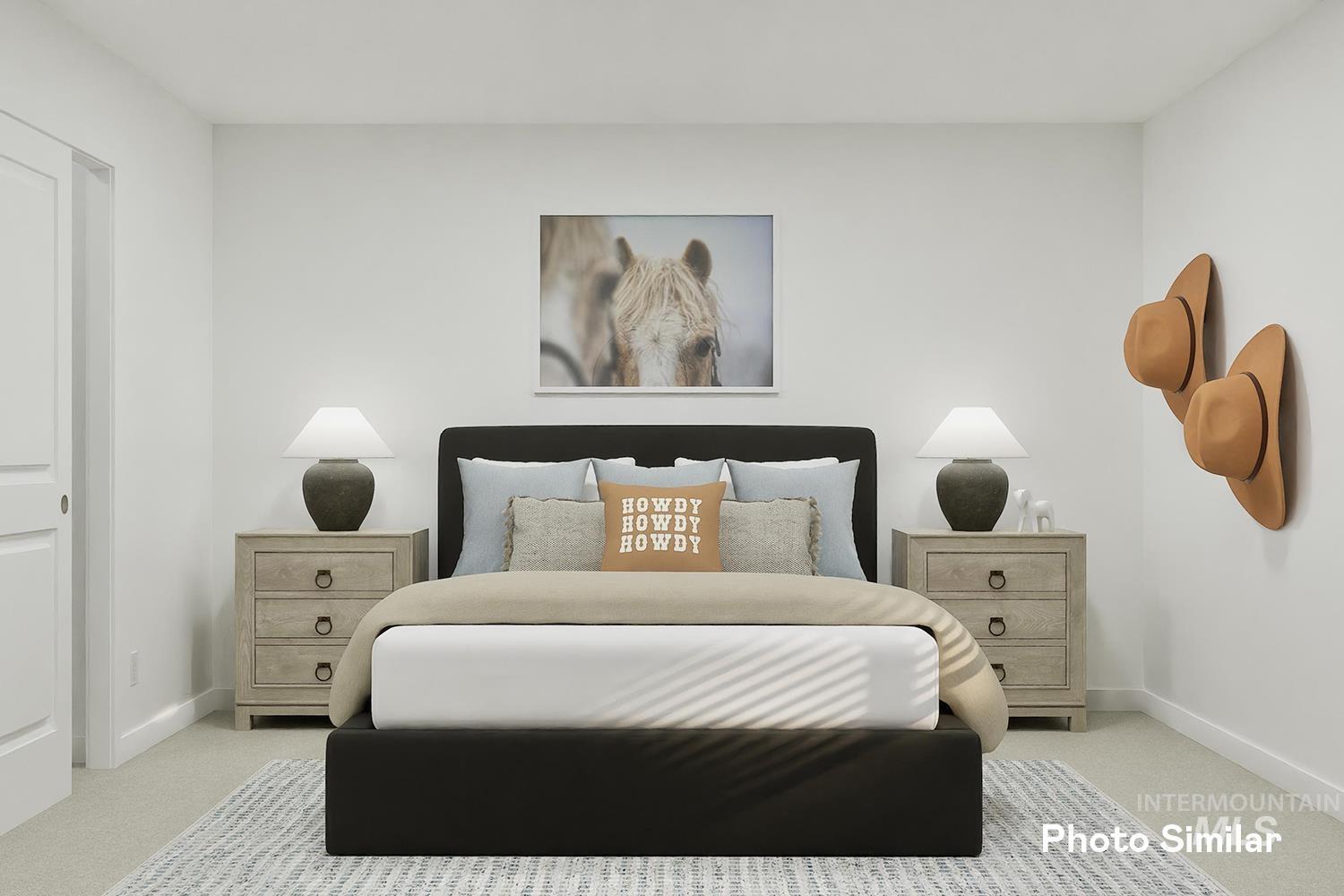 Bedroom featuring light colored carpet