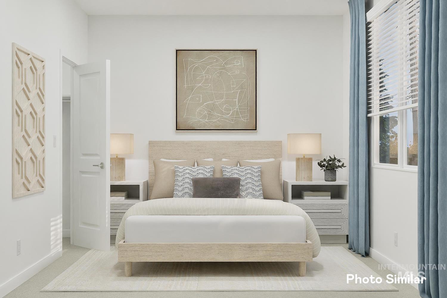 Carpeted bedroom featuring baseboards