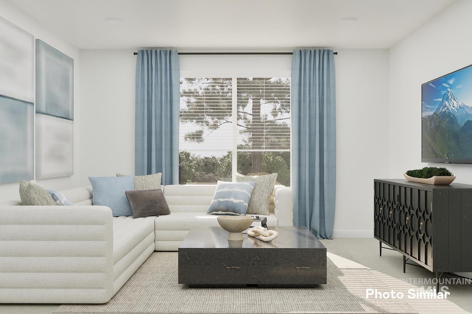 Carpeted living room featuring baseboards