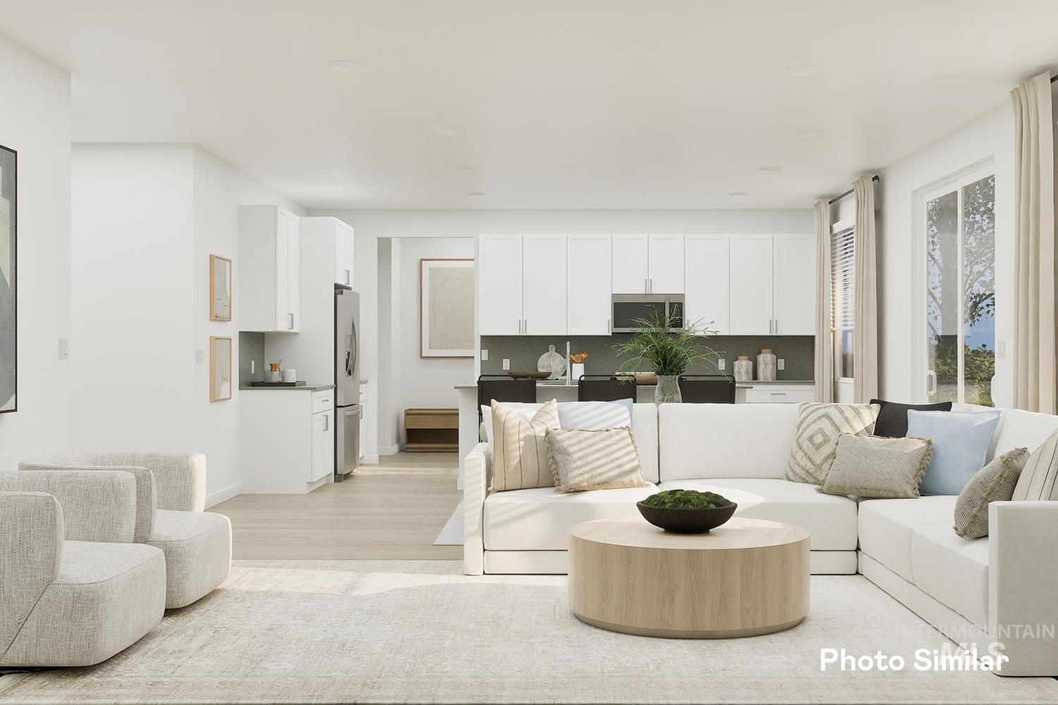Living area featuring light wood-style floors and baseboards