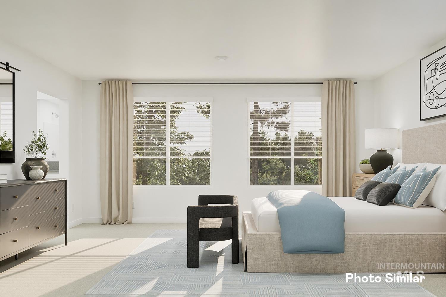 Carpeted bedroom featuring baseboards