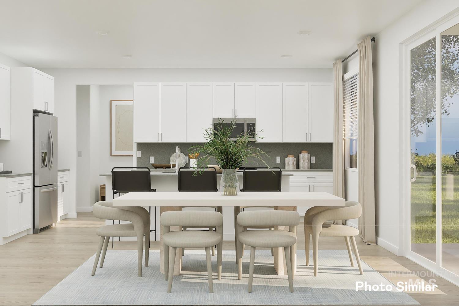 Kitchen featuring white cabinetry, light wood-type flooring, and decorative backsplash
