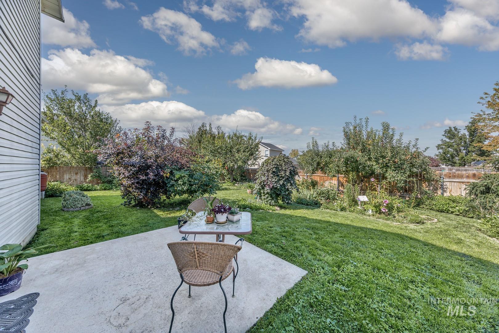 Fenced backyard featuring a patio