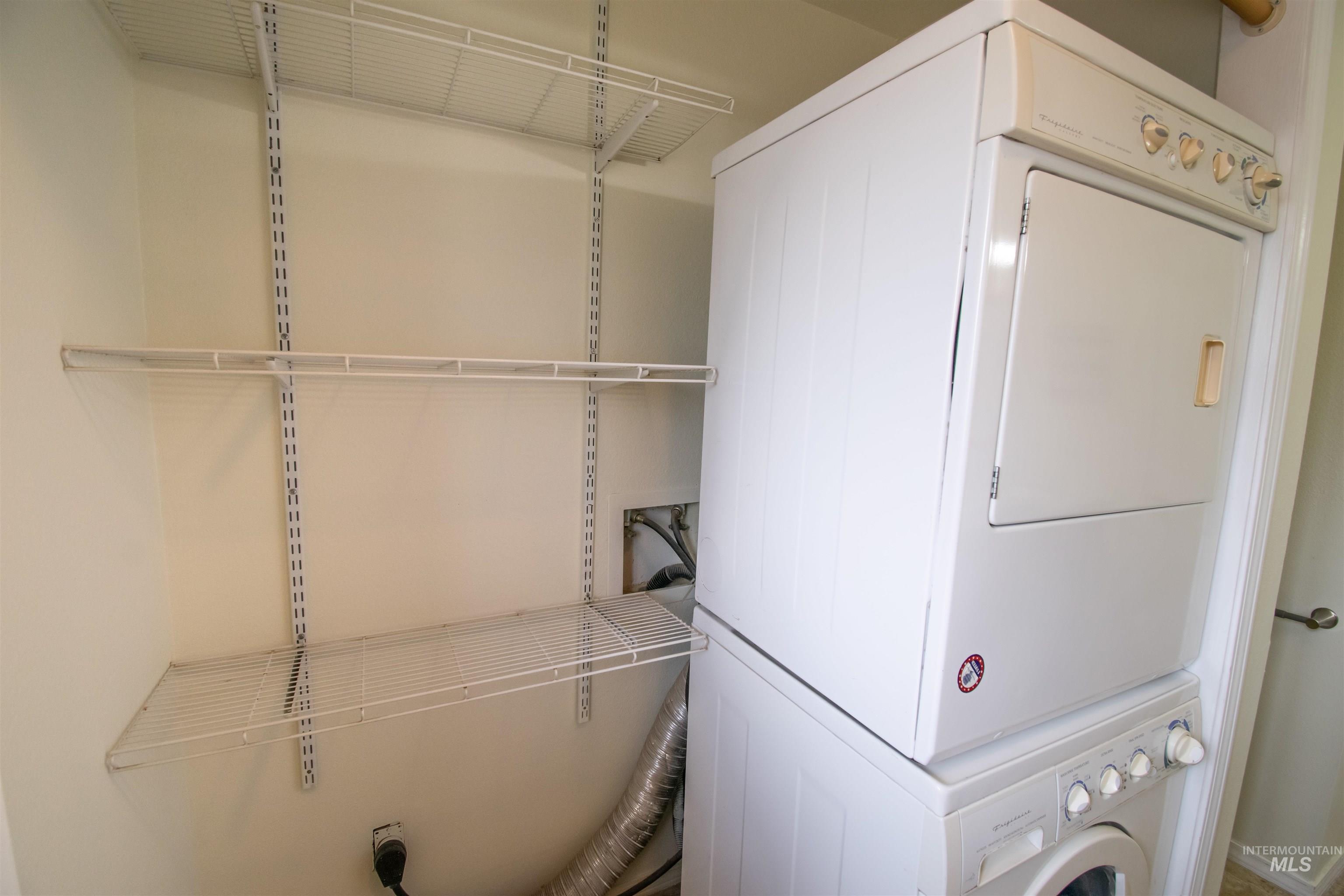Laundry room with stacked washer / dryer