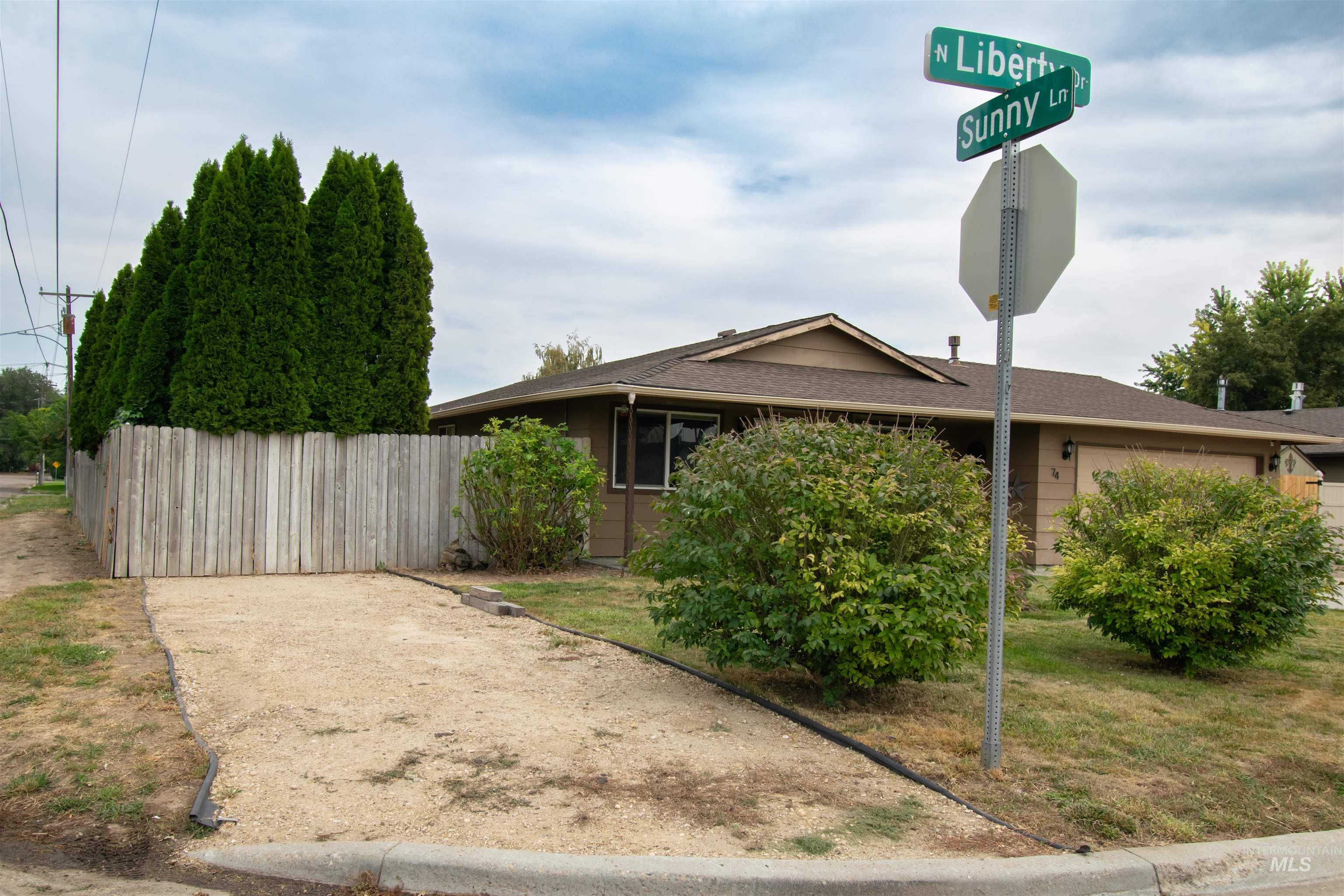View of front of home with a shingled roof