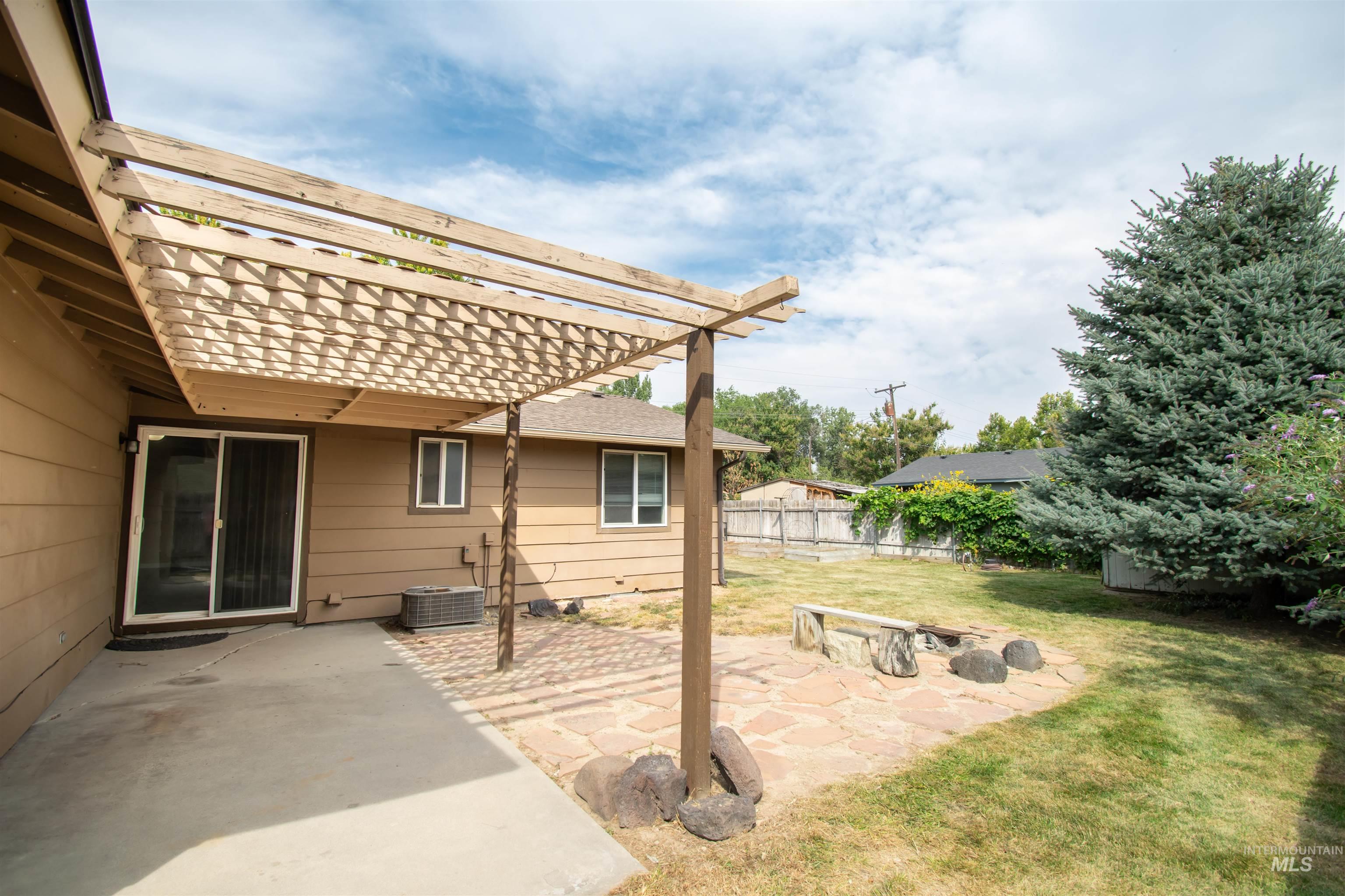 View of yard featuring a pergola and a patio area