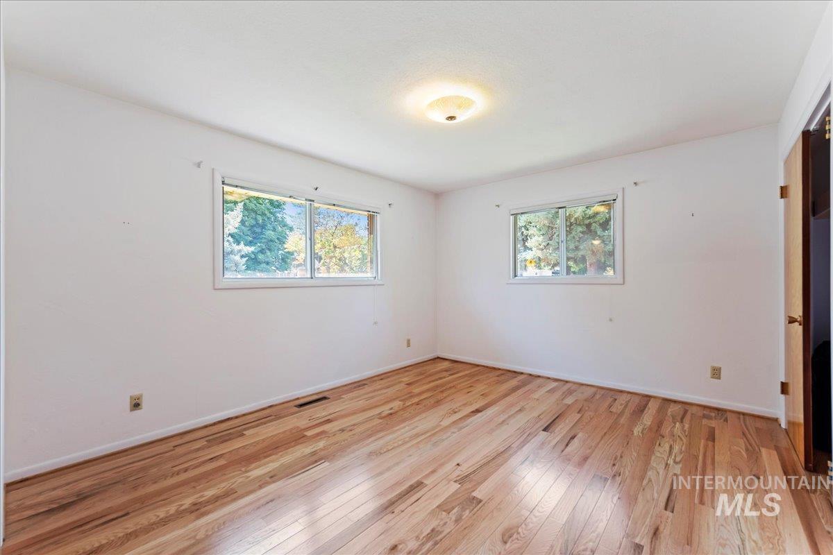Unfurnished bedroom featuring light wood finished floors
