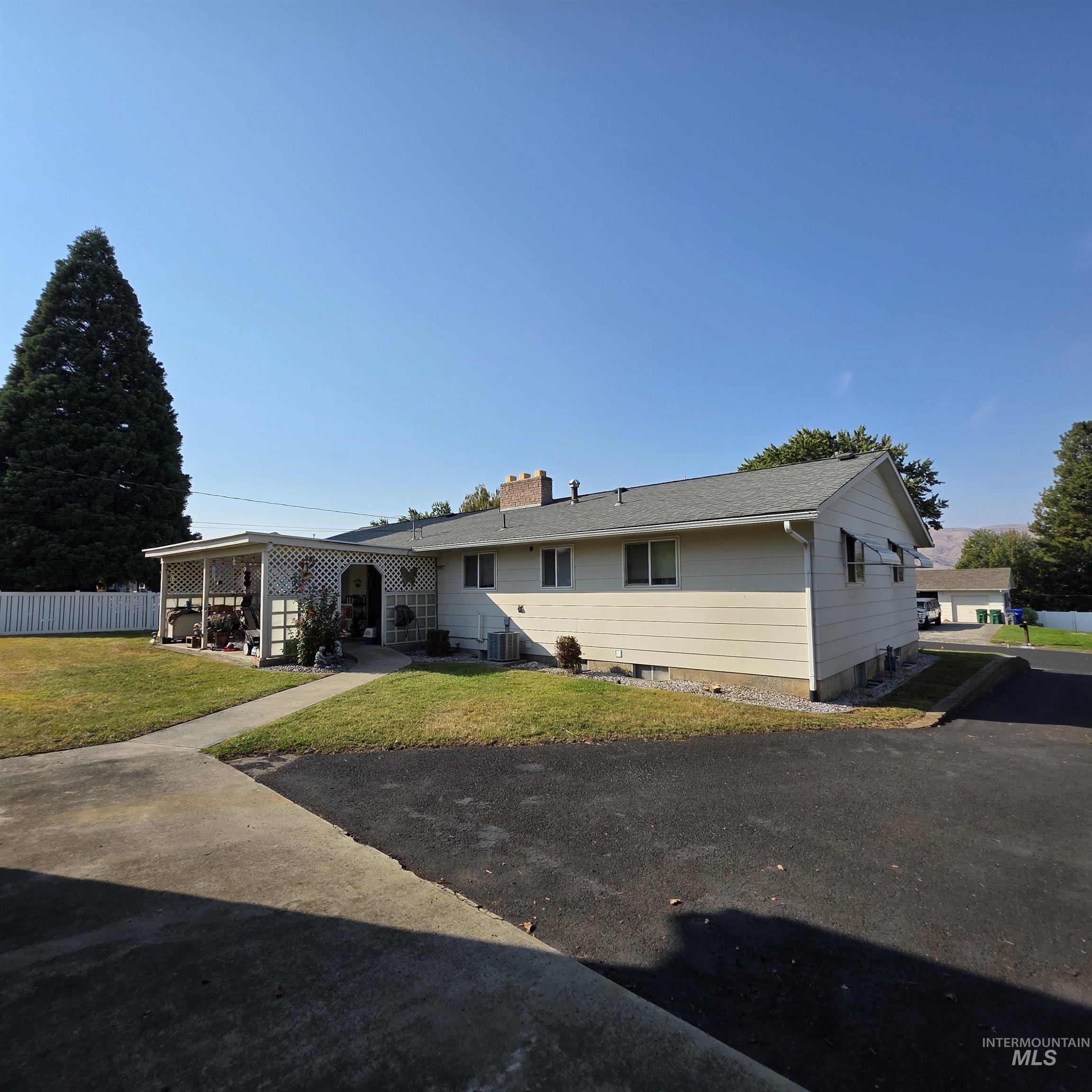 Rear view of property with a chimney